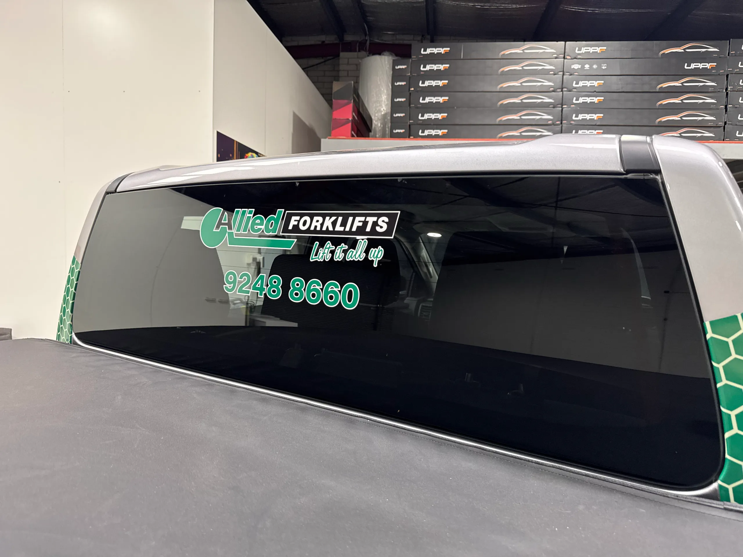 Allied Forklifts logo and contact lettering across the Triton rear window