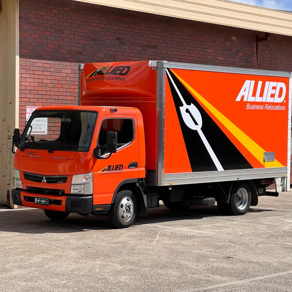 Completed Allied Movers truck viewed from the front quarter outdoors