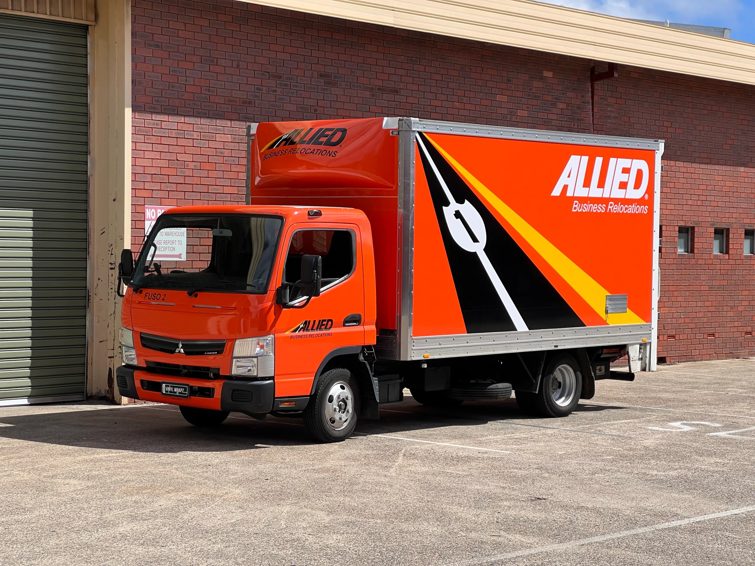 Completed Allied Movers truck viewed from the front quarter outdoors