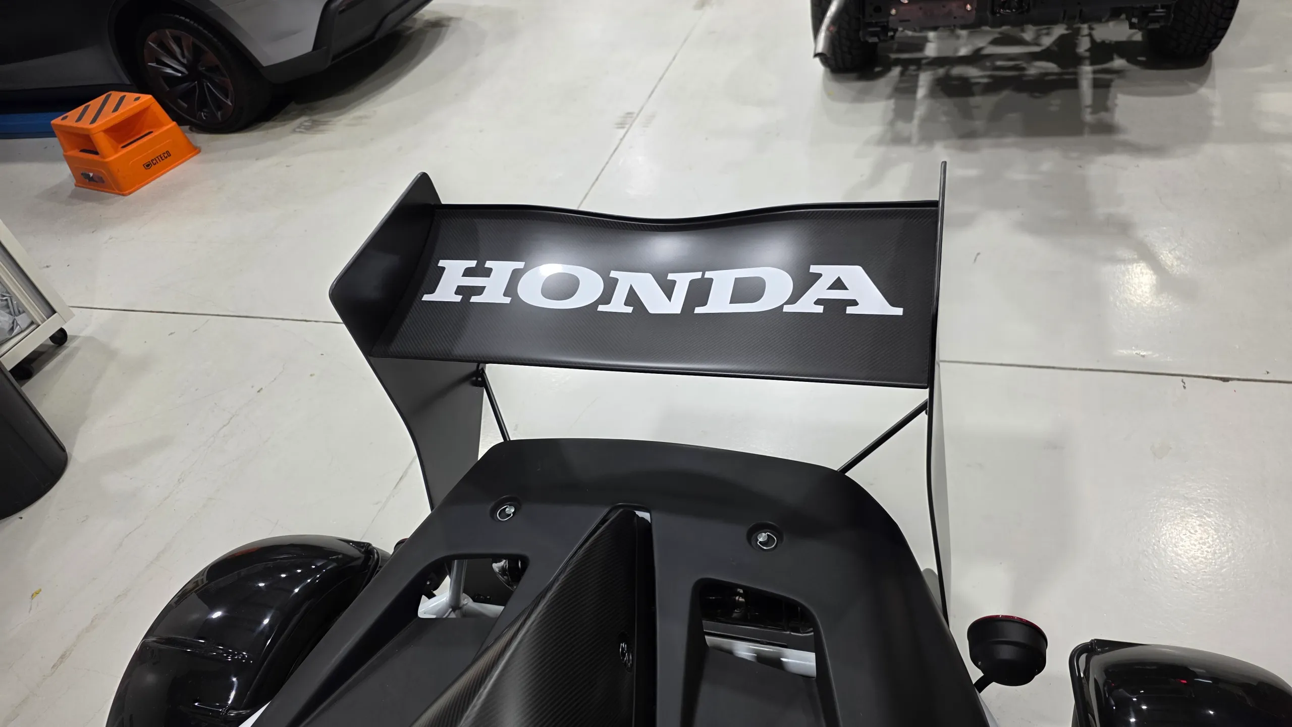 Honda lettering across the Ariel Atom rear wing viewed from above