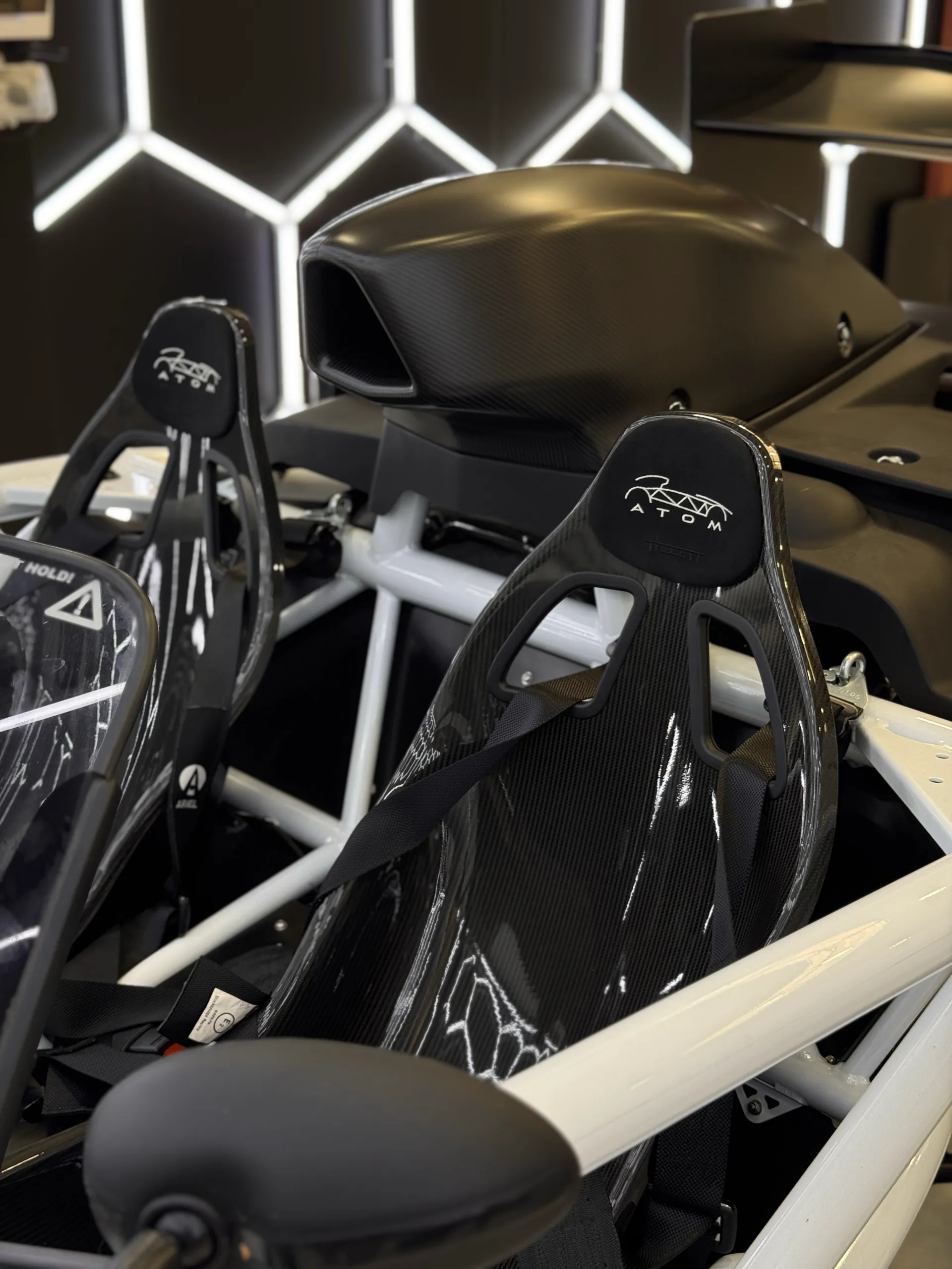 Ariel Atom bucket seats, white frame and air intake in the open cockpit