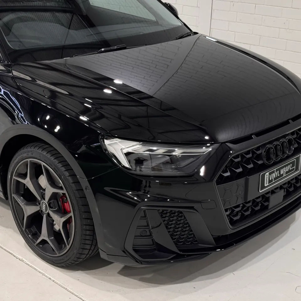 Audi A1 gloss black bonnet, grille and front wheel viewed from above
