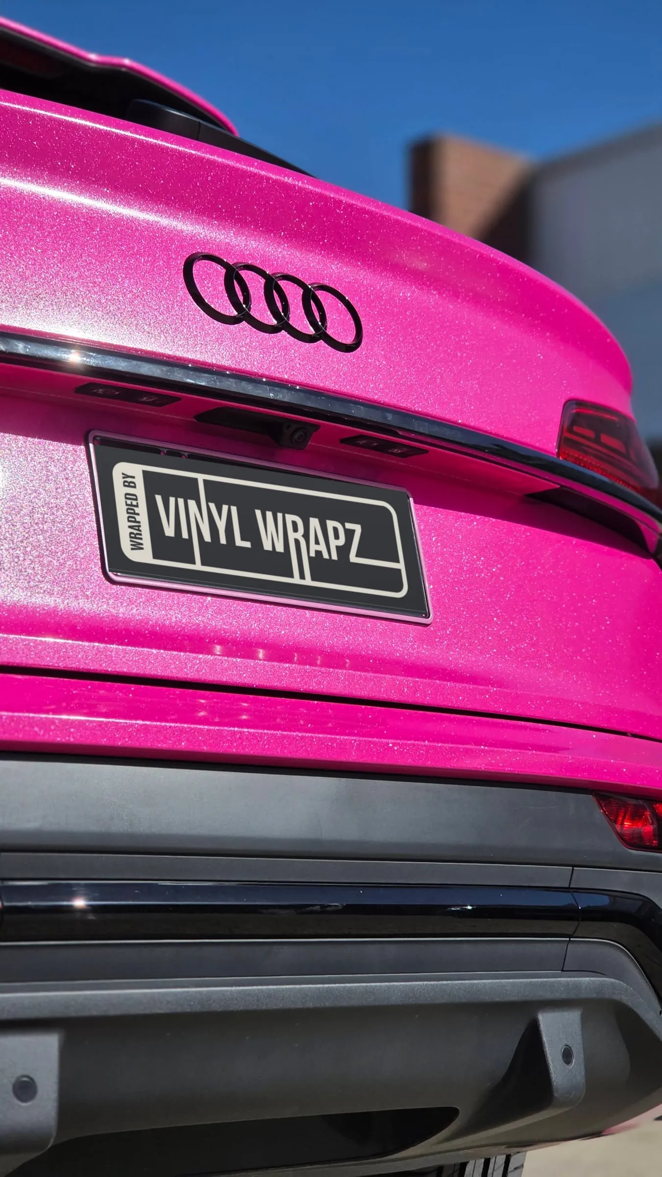 Audi Q5 Sportback rear in a metallic pink colour change wrap with a Wrapped by Vinyl Wrapz plate
