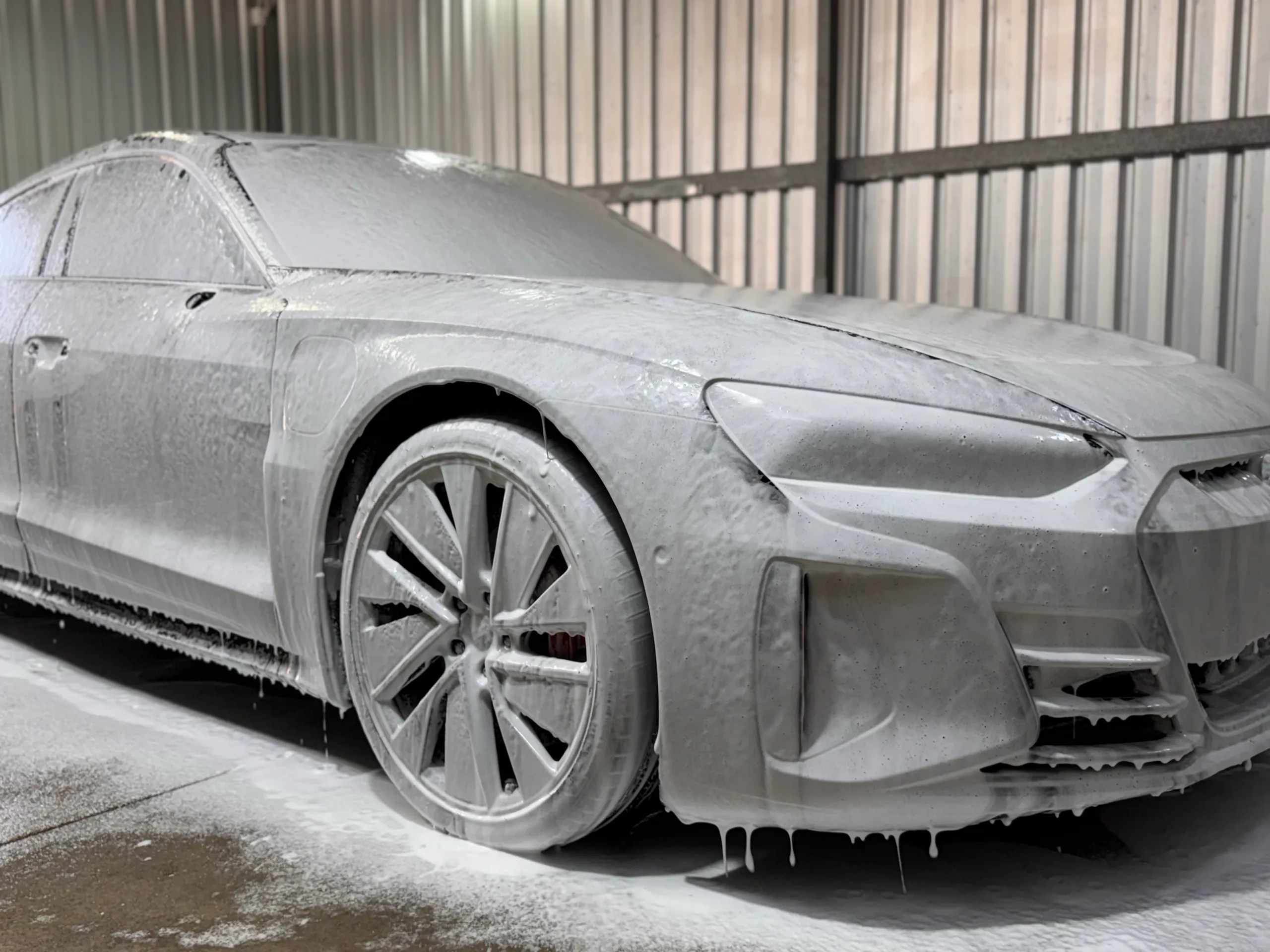 Audi RS e-tron GT covered in washing foam before film installation