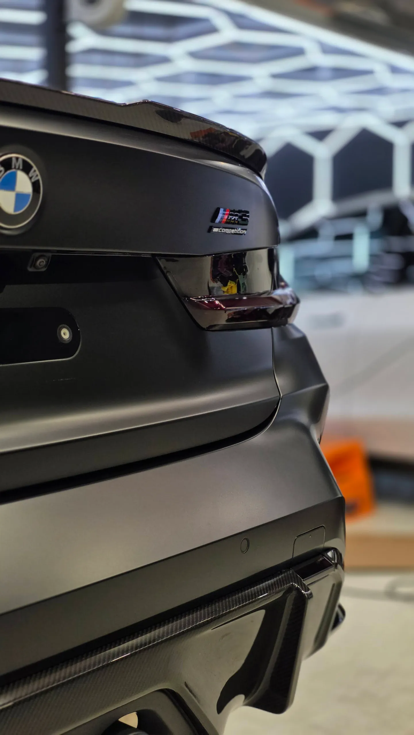 BMW M3 Competition badge and spoiler above the satin dark grey boot lid