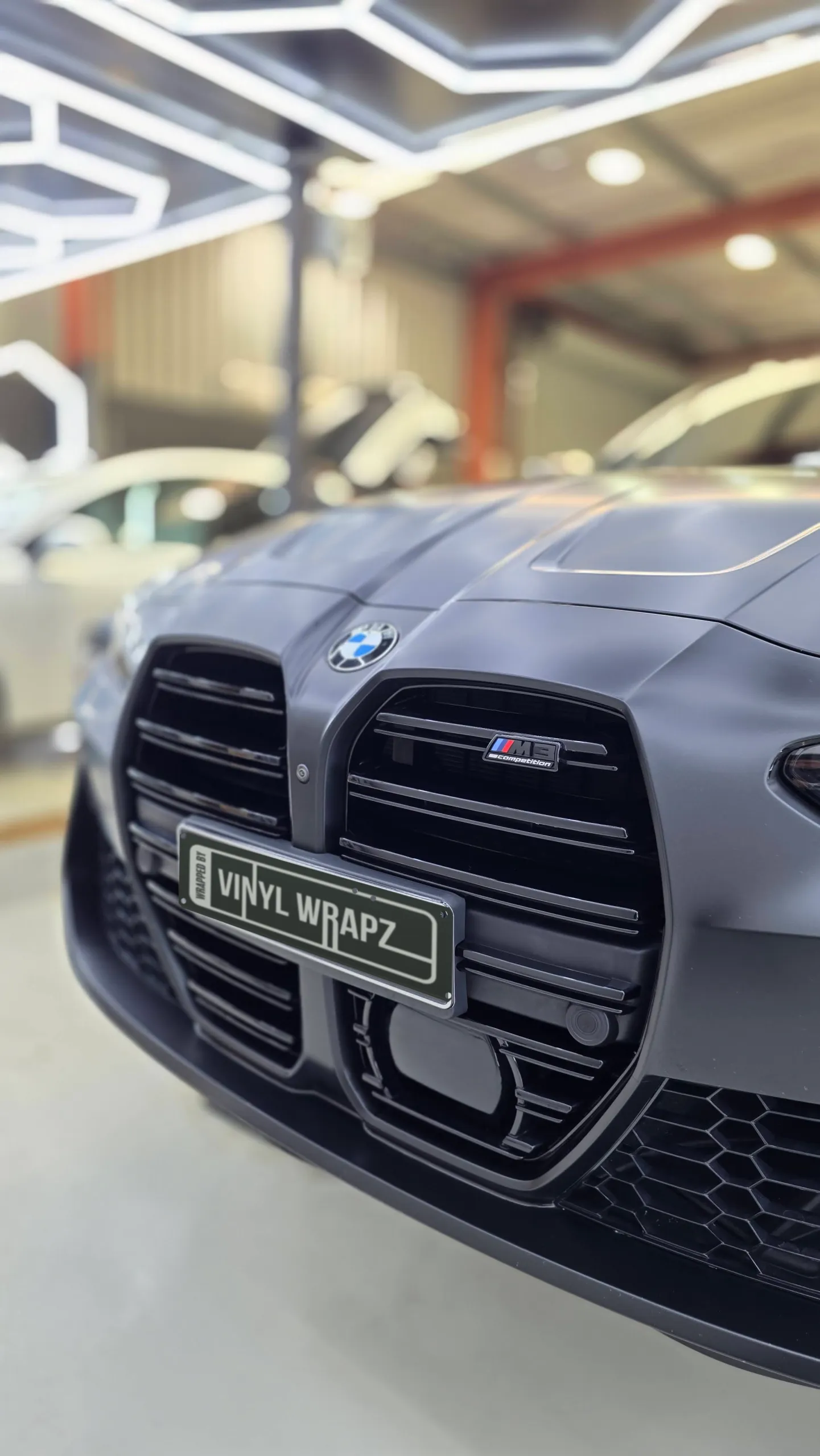 BMW M3 Competition grille and satin grey bonnet in the workshop