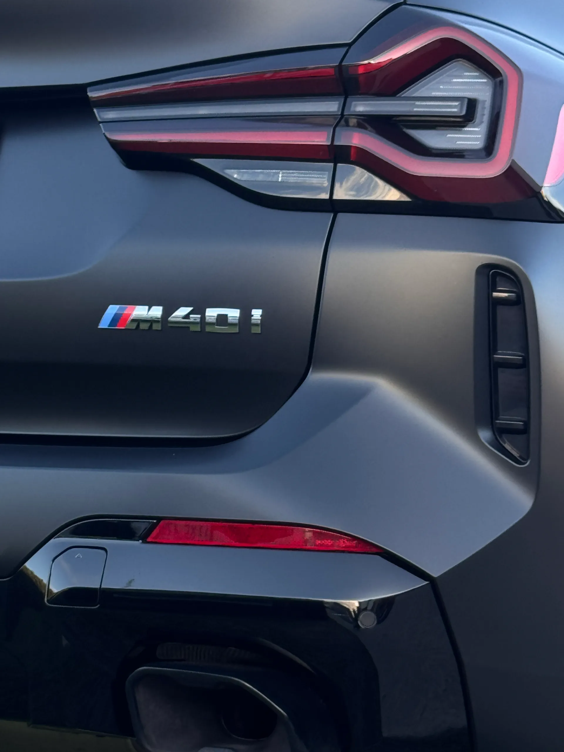 M40i badge and rear light on the matte dark grey BMW X3 tailgate
