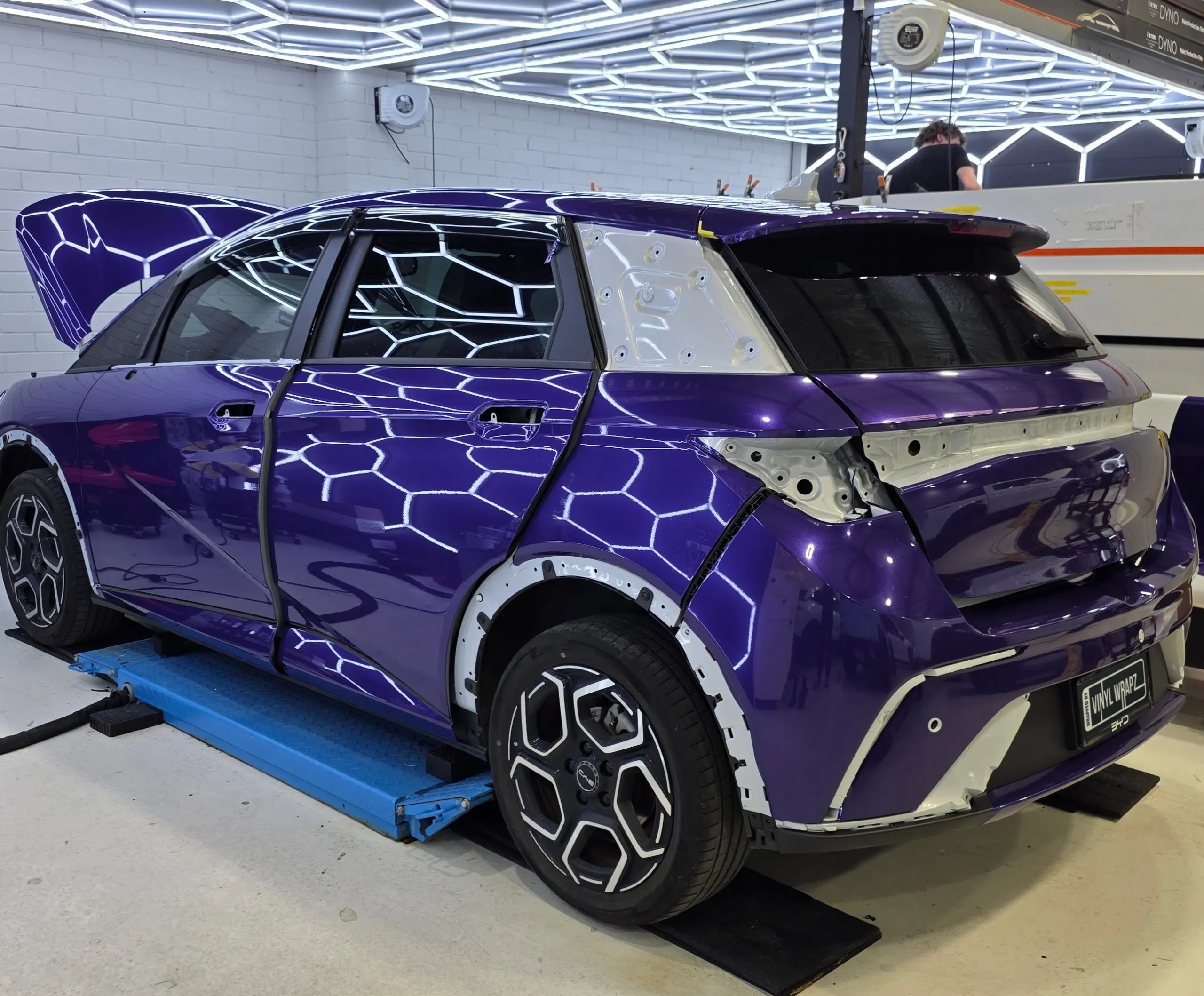 Purple BYD Atto 3 during installation with rear lights and exterior trim removed
