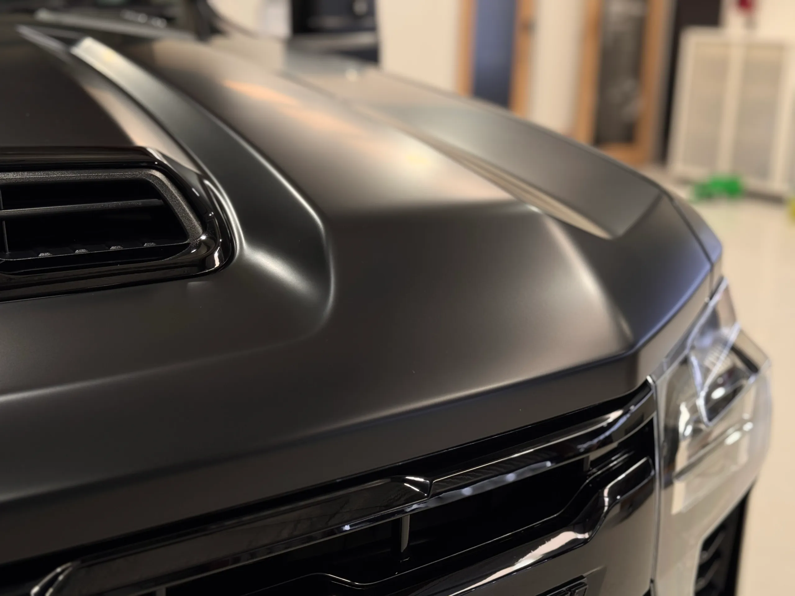 Close view across the matte Silverado bonnet and raised centre intake