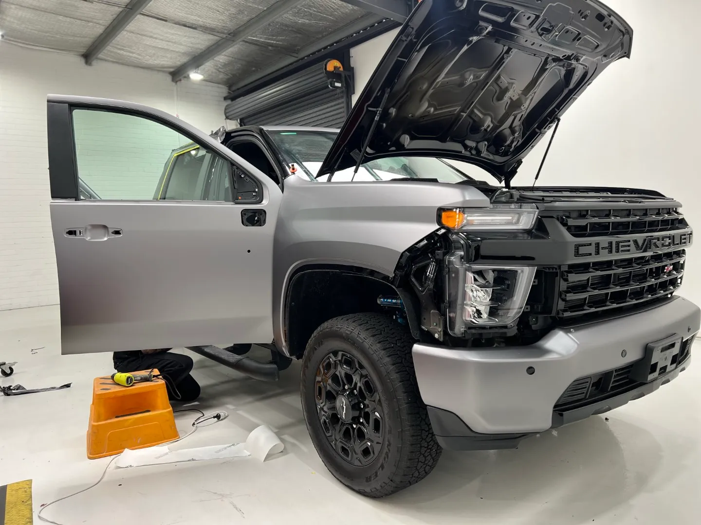 Chevrolet Silverado during wrapping with the bonnet and door open