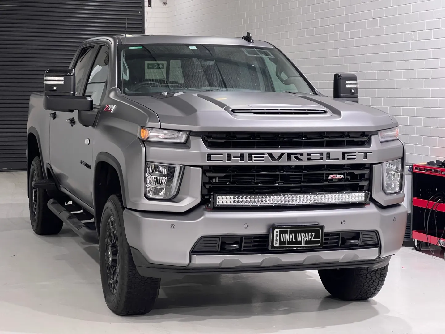 Matte anthracite Chevrolet Silverado from the front in the workshop
