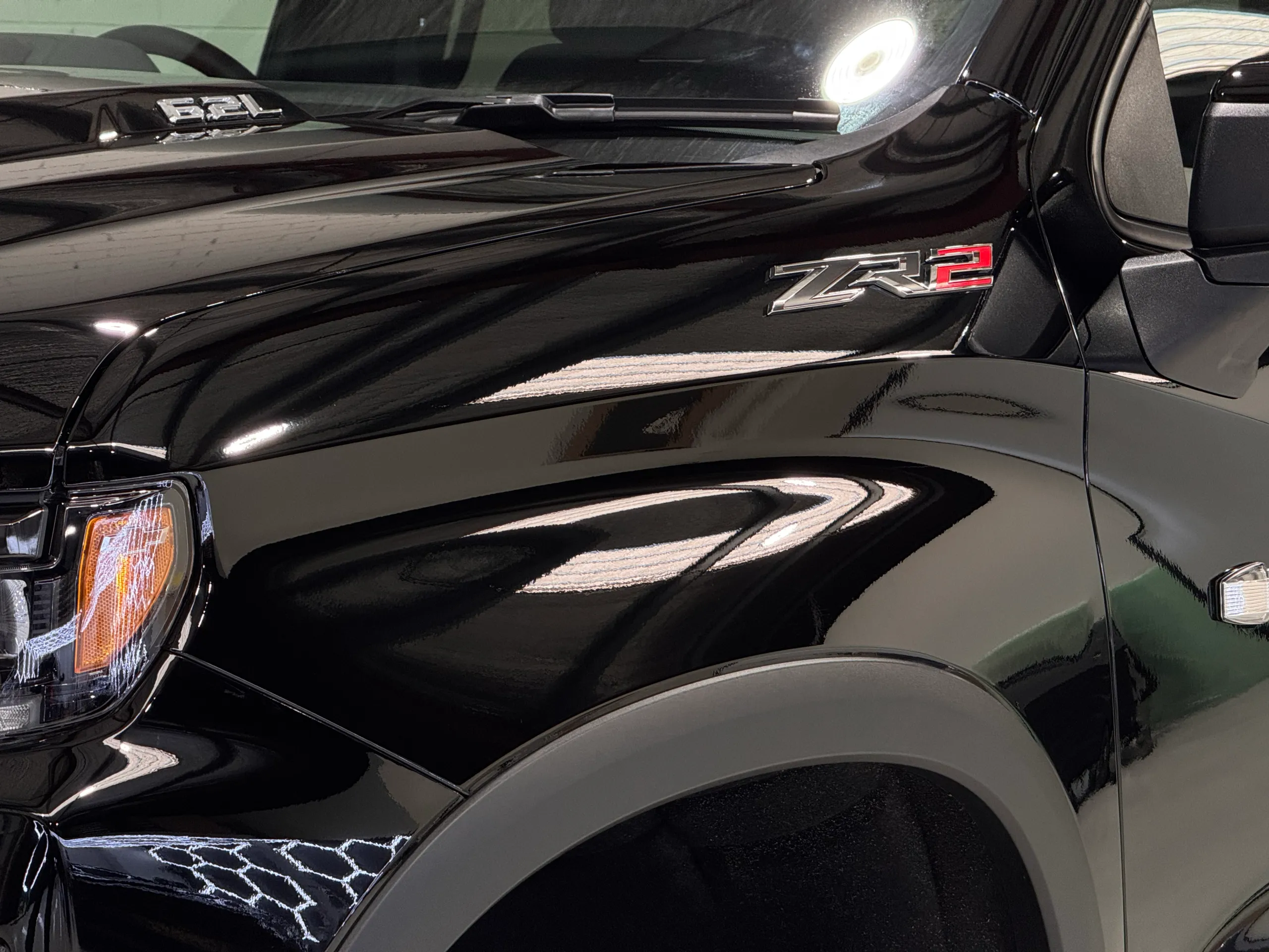 ZR2 badge beside the Silverado gloss black bonnet and front guard