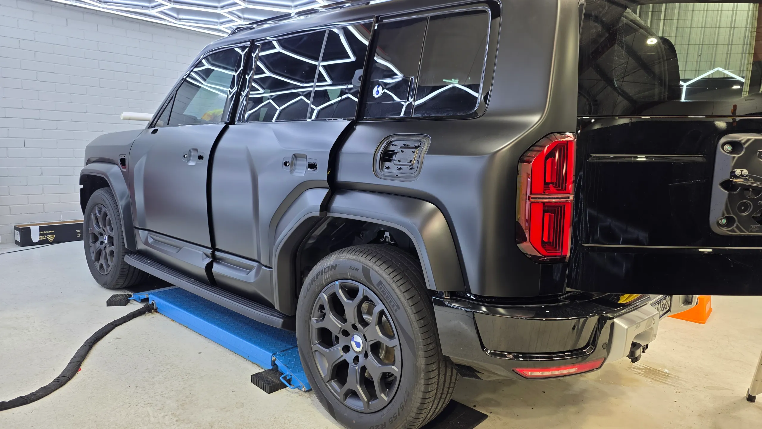Denza B5 during installation with handles, trim and spare wheel removed