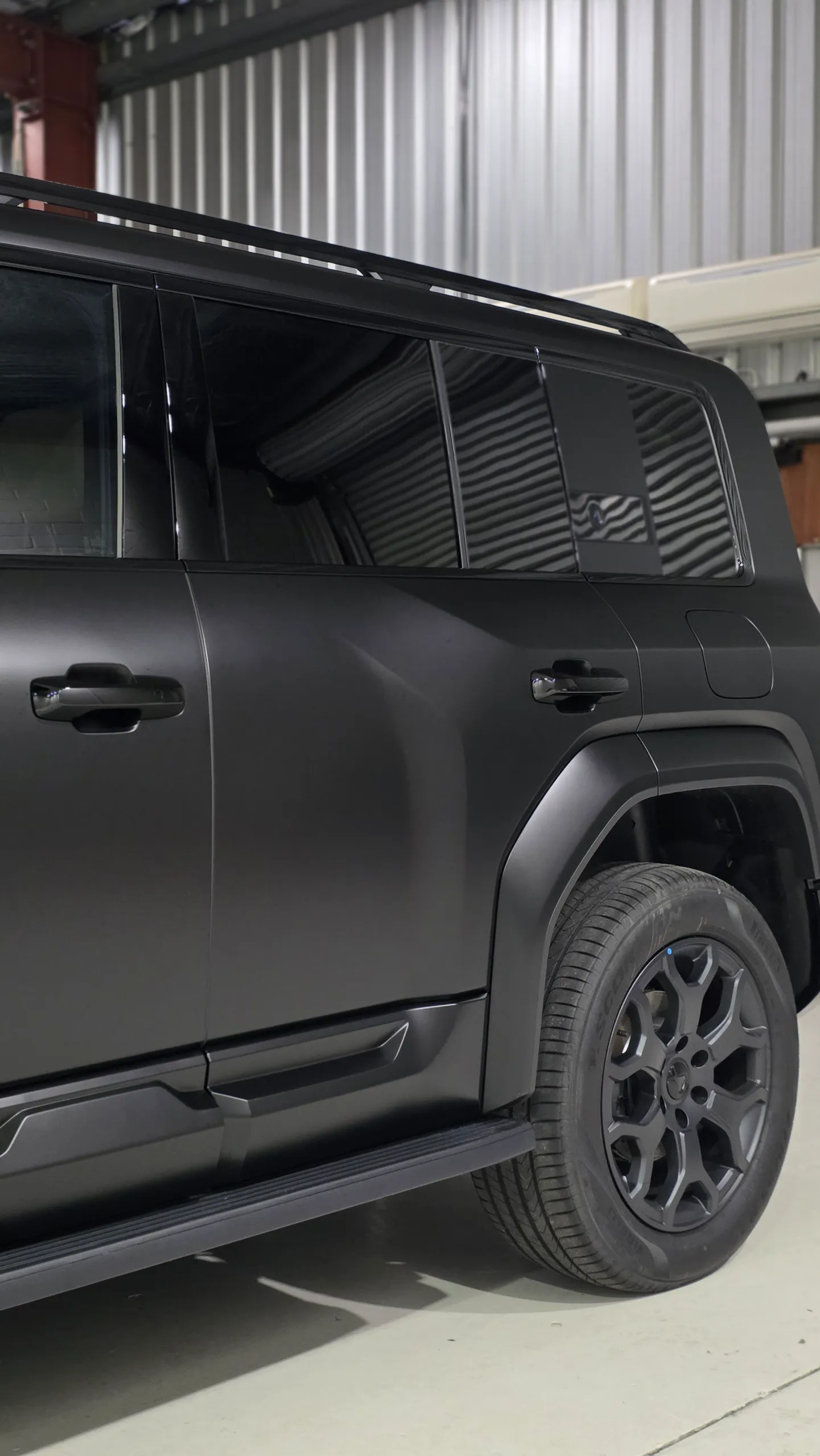 Satin grey Denza B5 rear door, side step and rear wheel