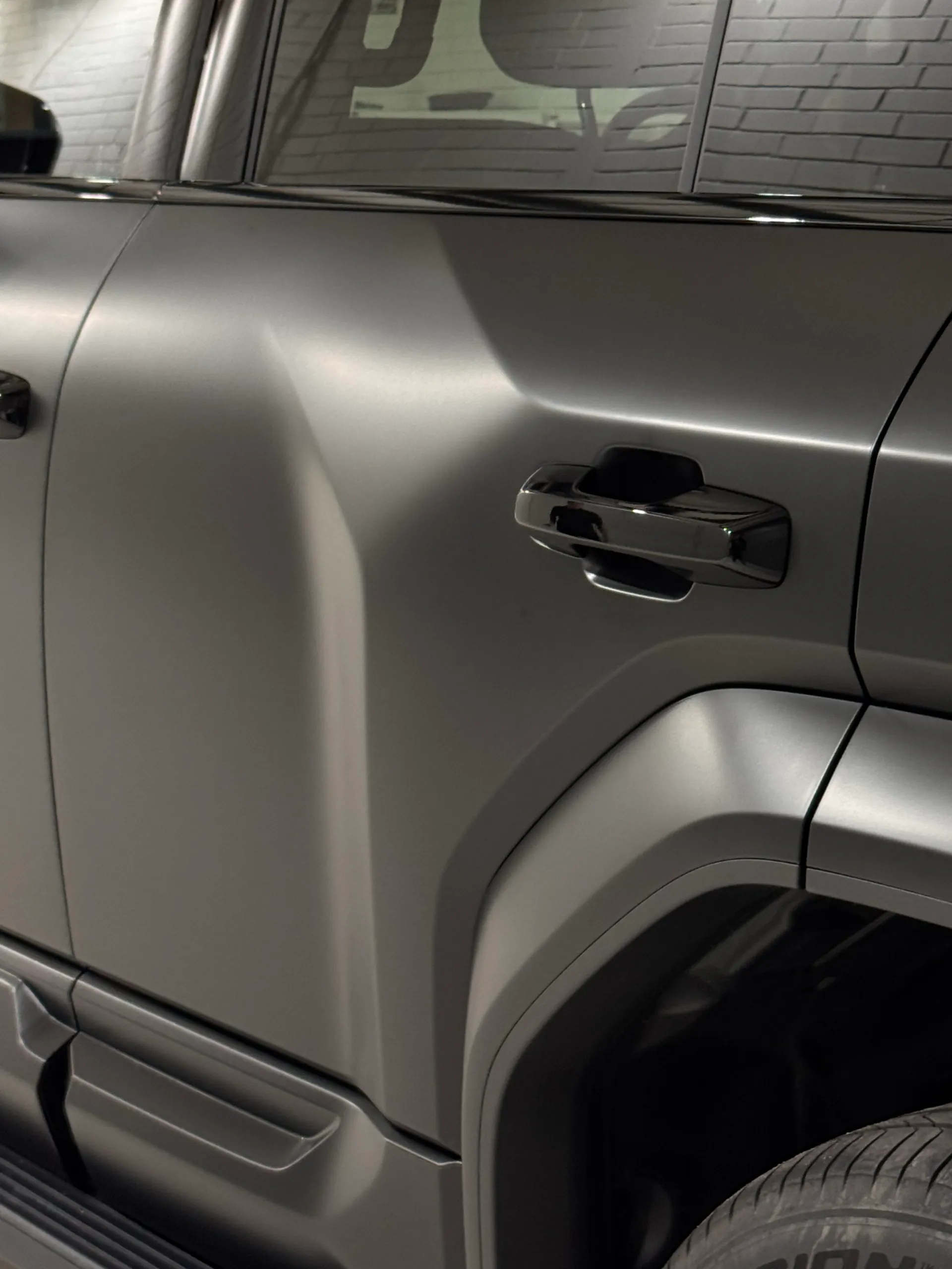 Denza B5 rear door and handle above the satin grey rear wheel arch