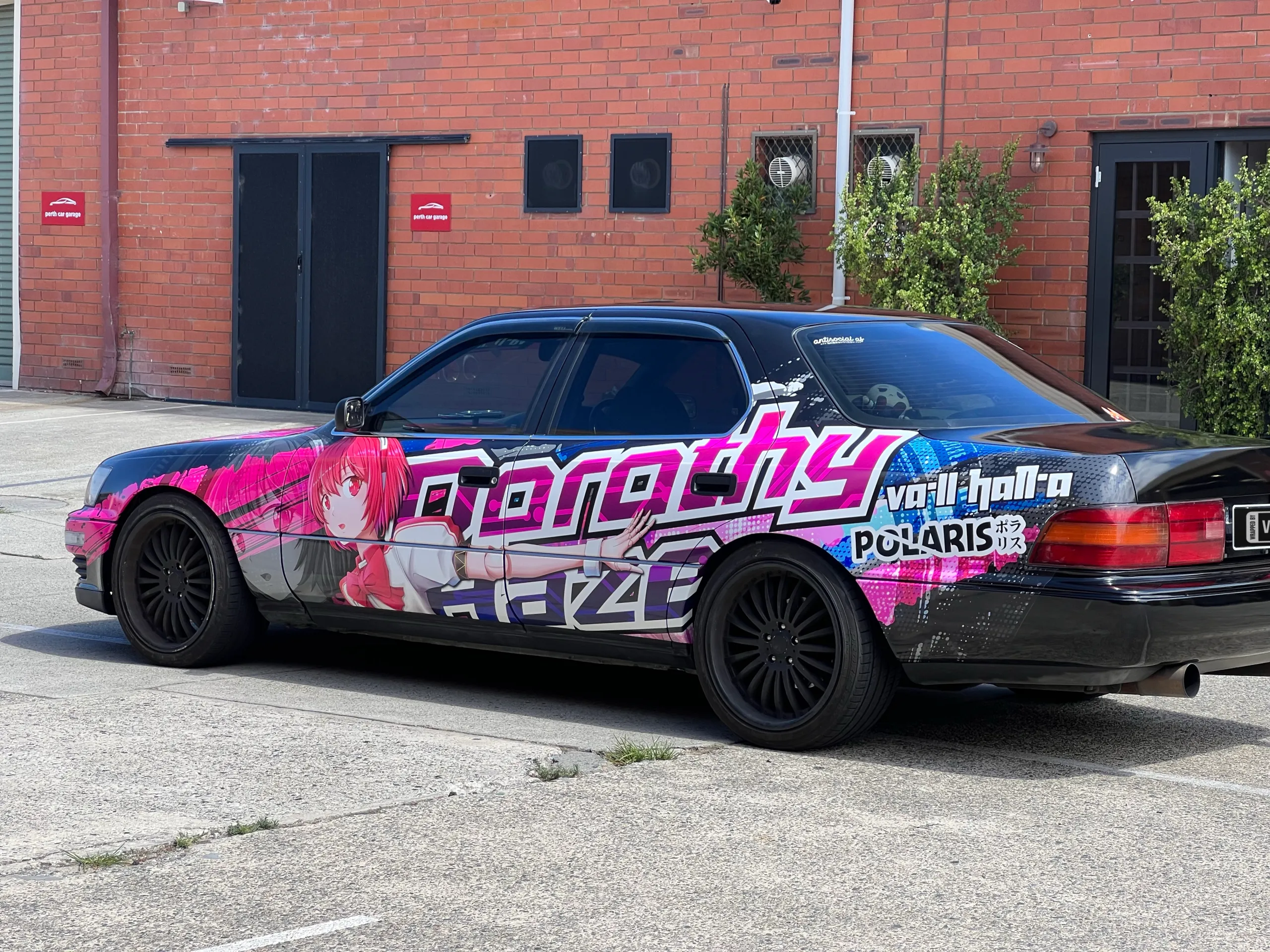 Rear-quarter view of the wrapped Toyota outdoors