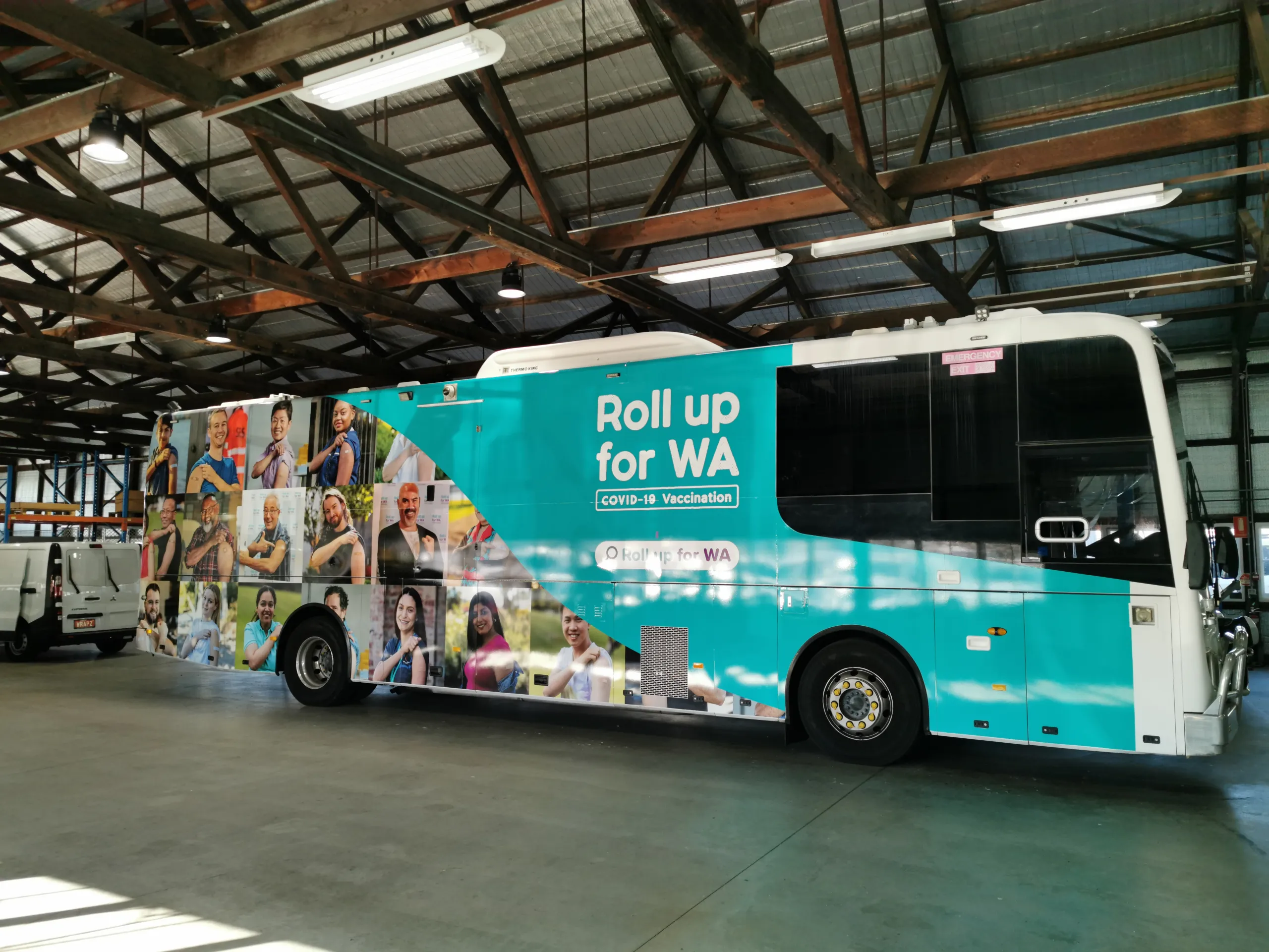 Completed vaccination coach with Roll Up for WA graphics