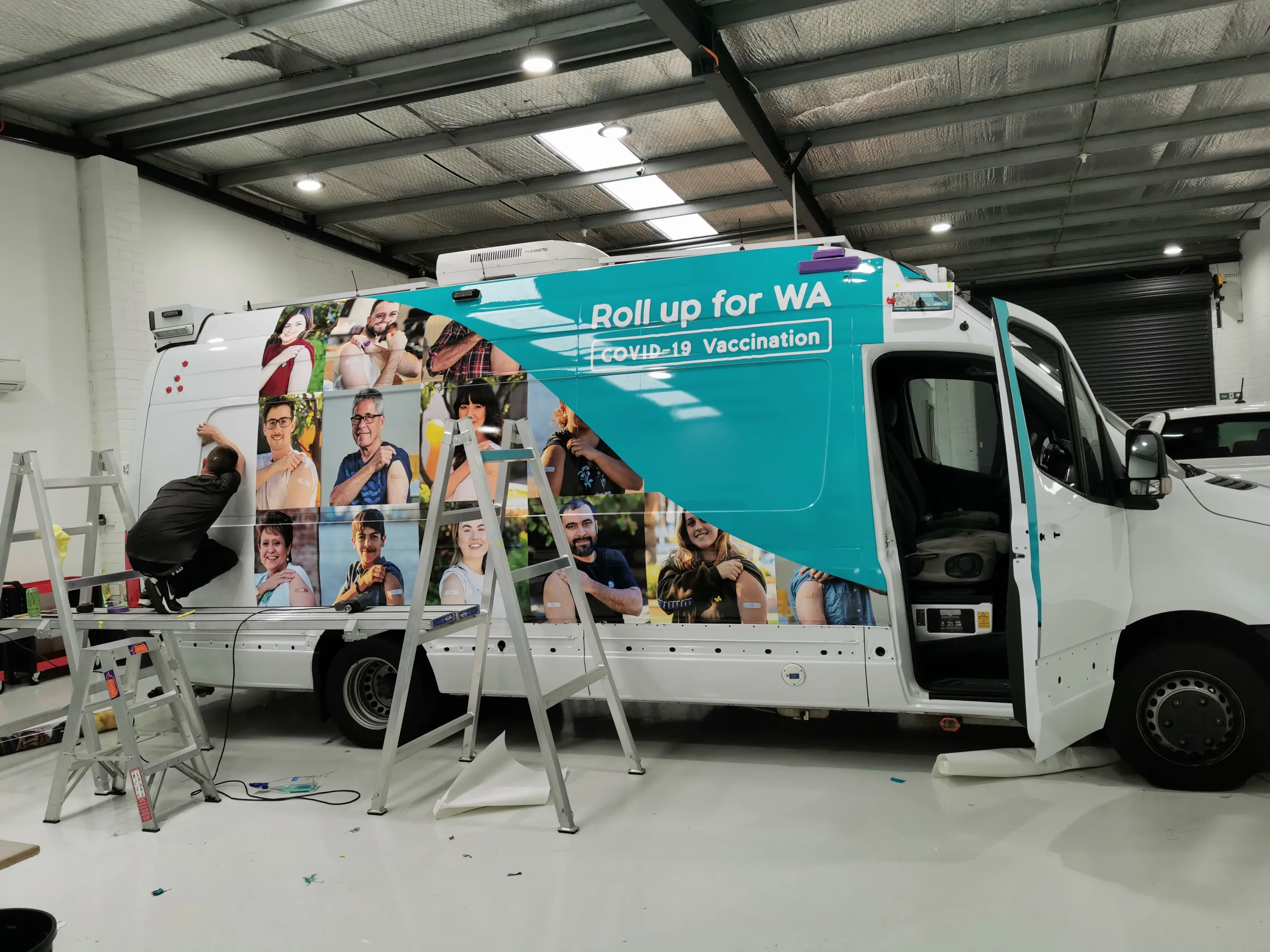 Installer applying film to the Sprinter rear body panel
