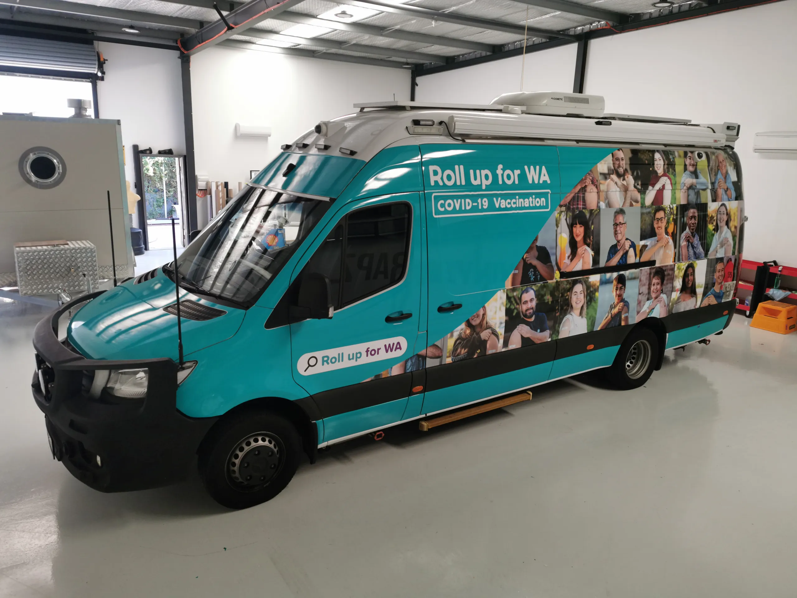 Completed vaccination van viewed from the front quarter outdoors