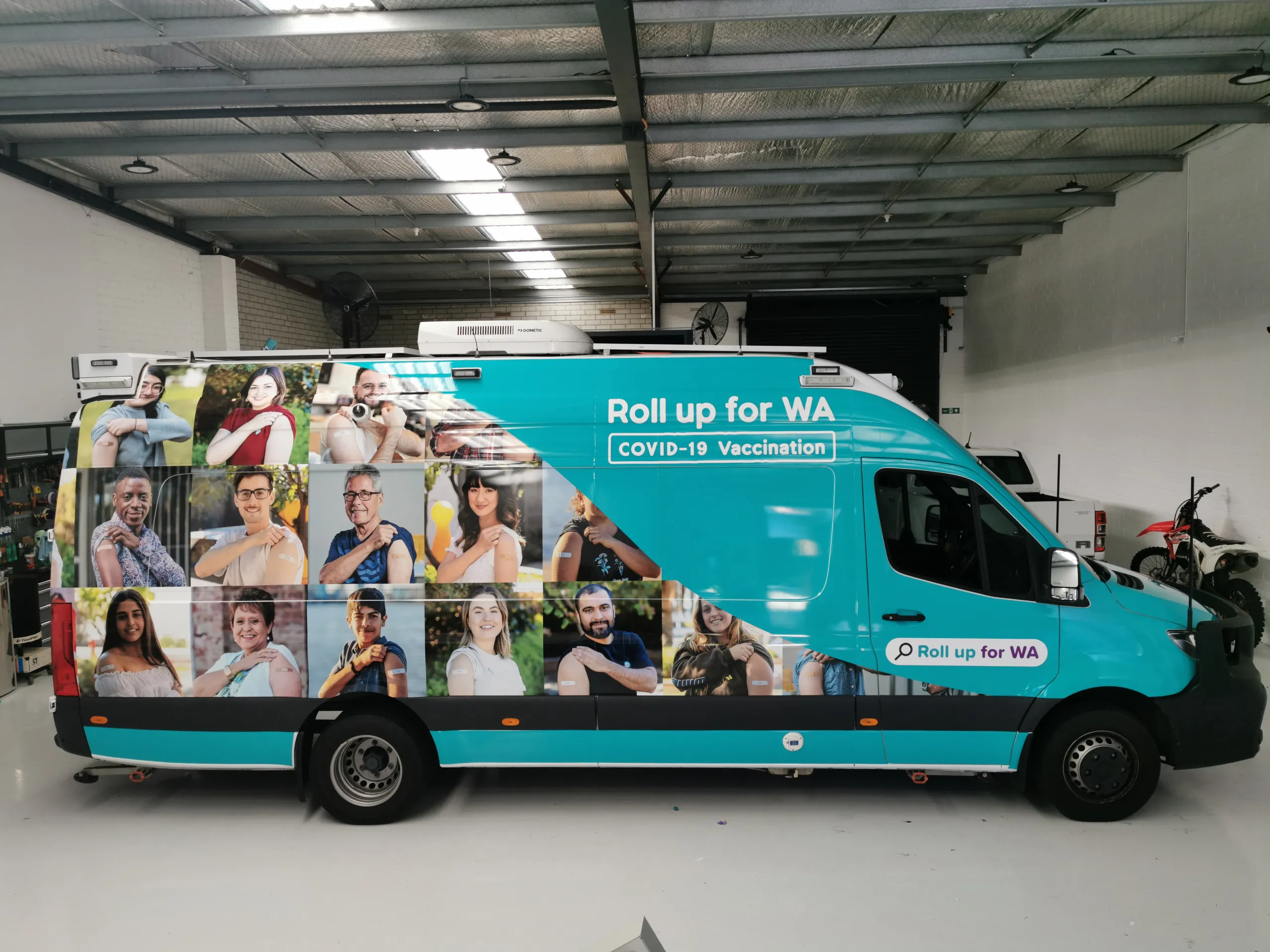 Side view of the completed Sprinter vaccination graphics