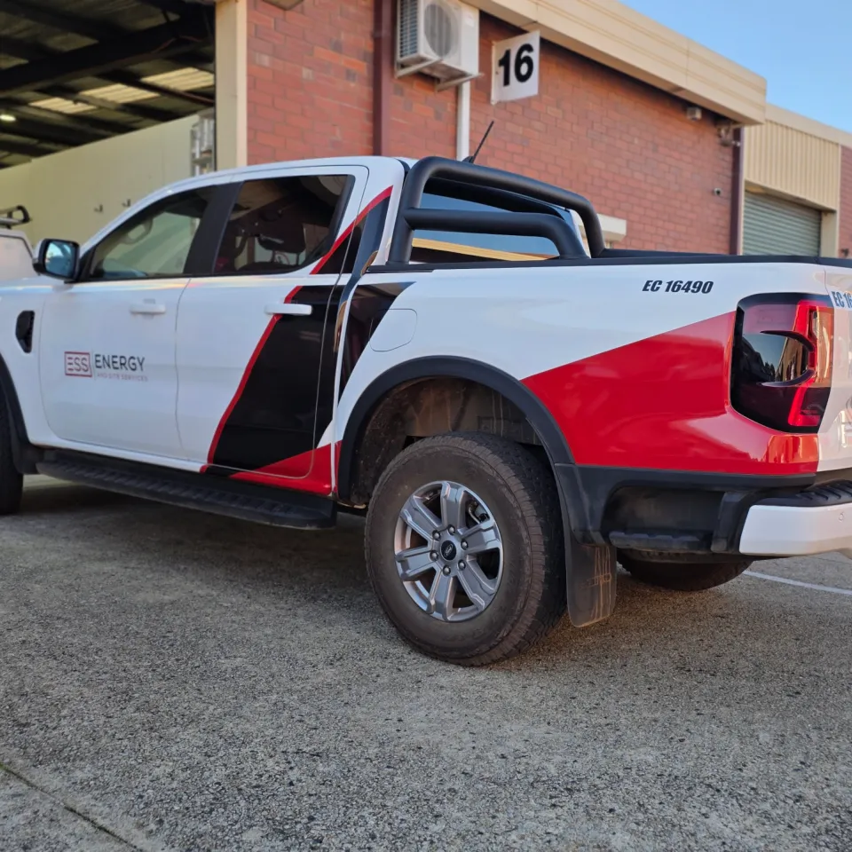 White Ford Ranger with ESS Energy and Site Services graphics across its doors and tray