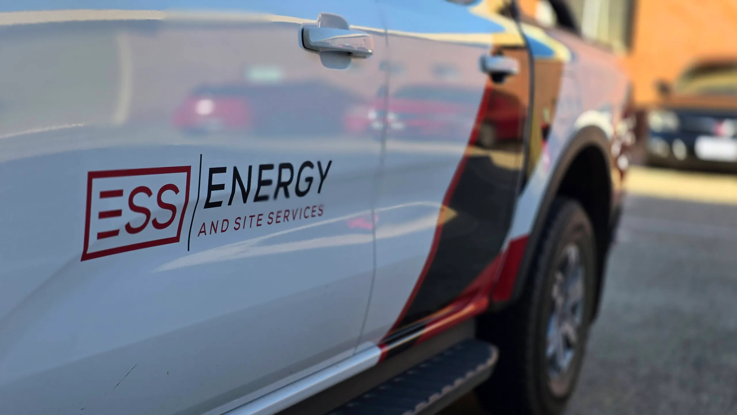ESS Energy and Site Services logo across the white Ford Ranger doors