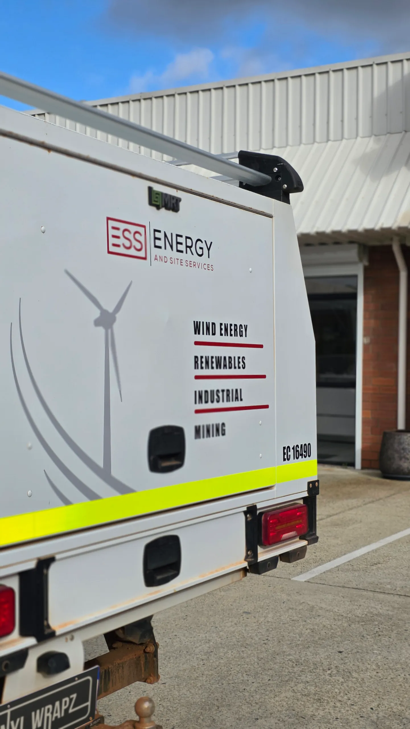 ESS service lettering and wind-turbine graphics on the Hilux canopy rear