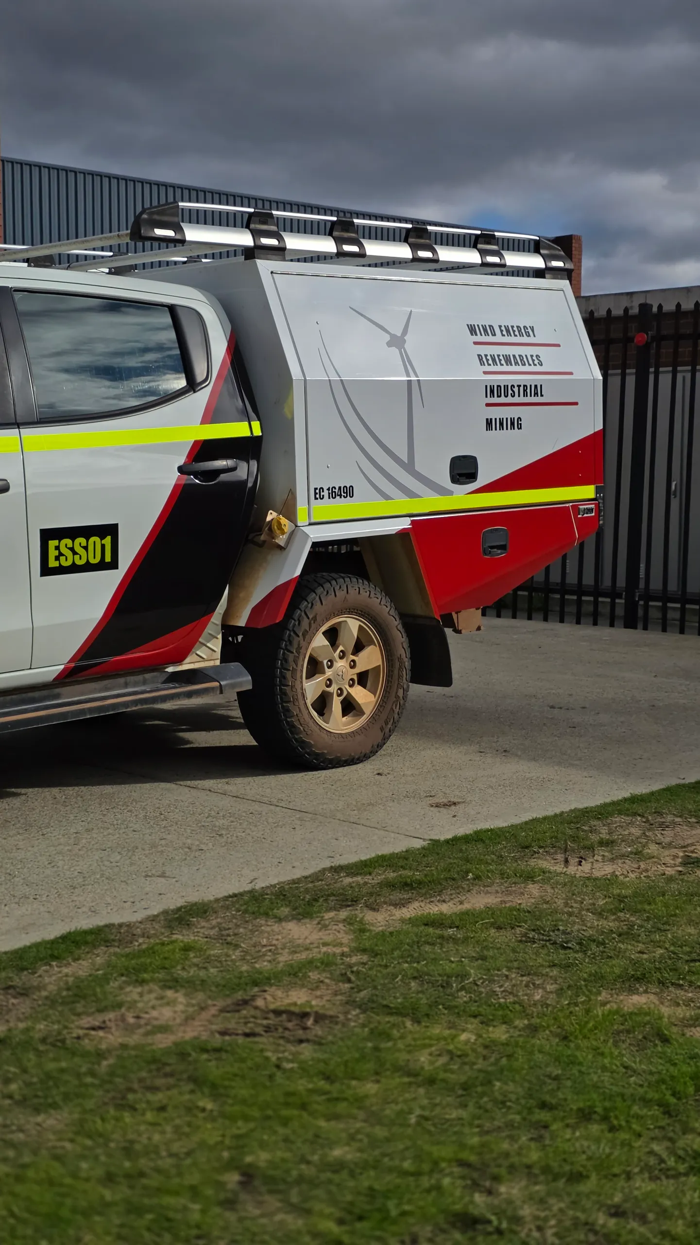 ESS graphics along a Toyota Hilux service canopy above the rear wheel