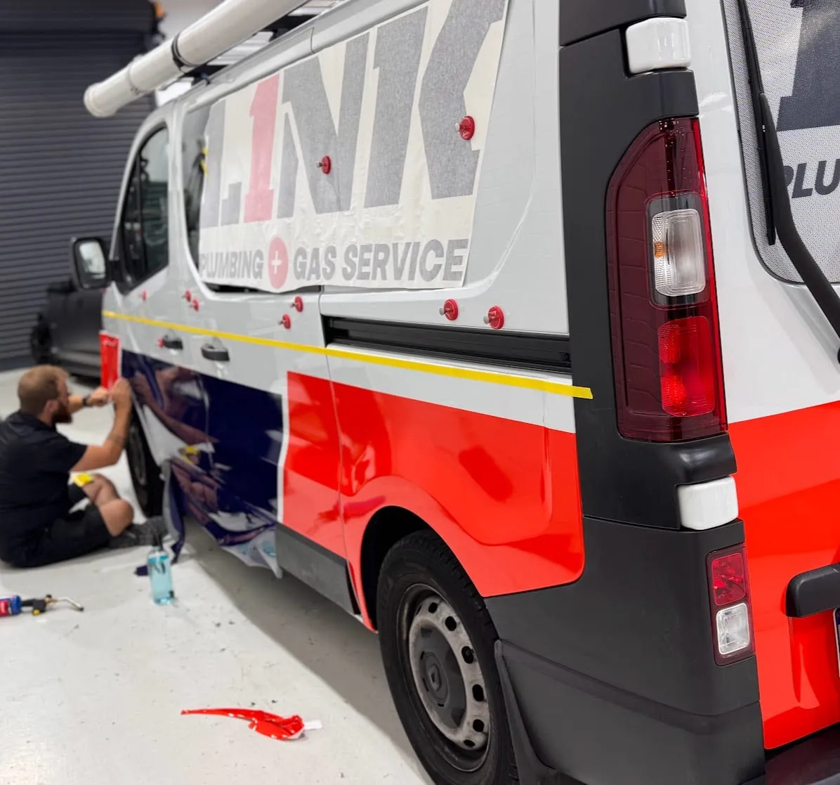 Link Plumbing and Gas Service van in the Vinyl Wrapz workshop with the partial wrap being fitted