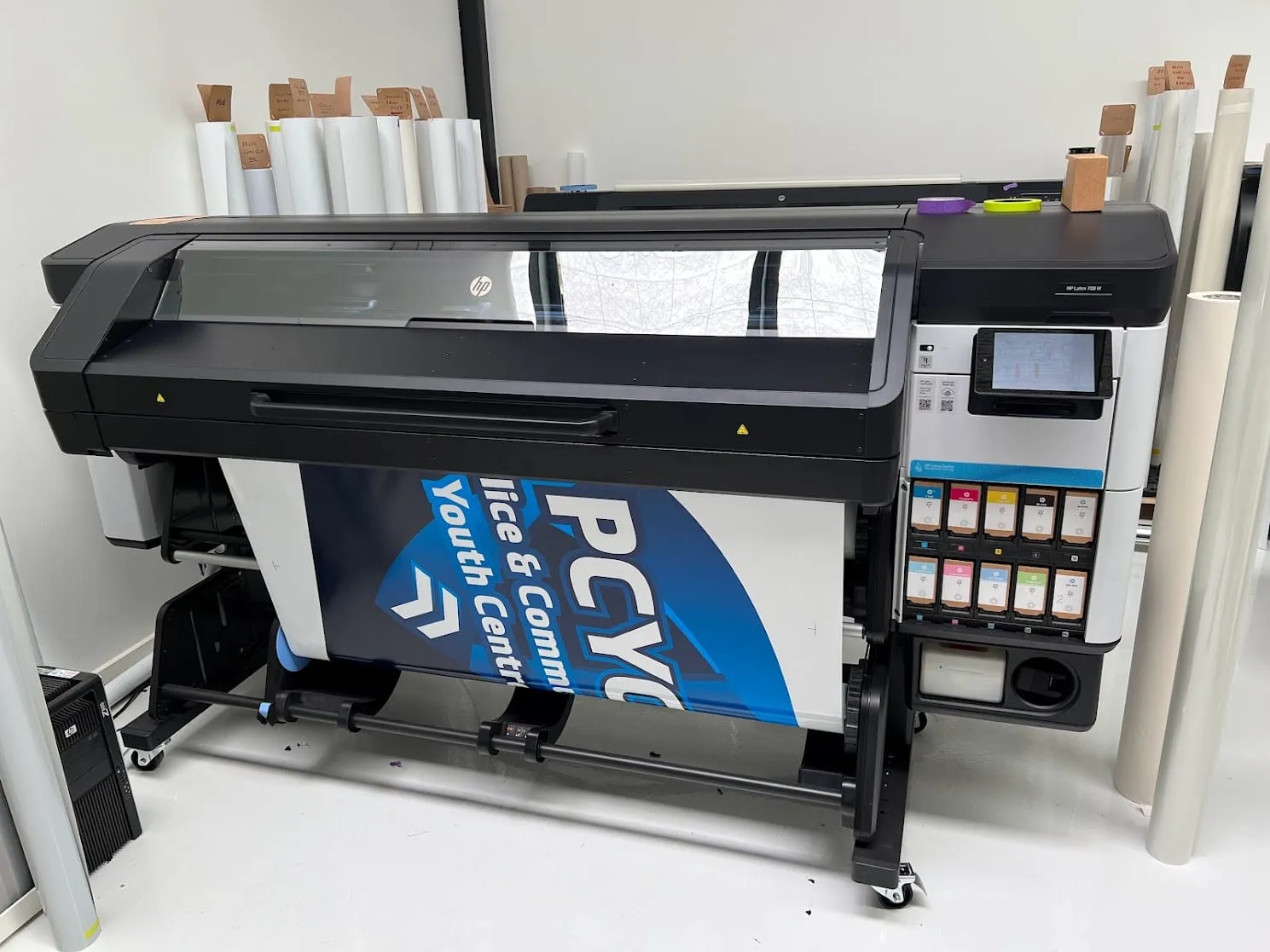 PCYC fleet graphics coming off the printer in the Vinyl Wrapz print room