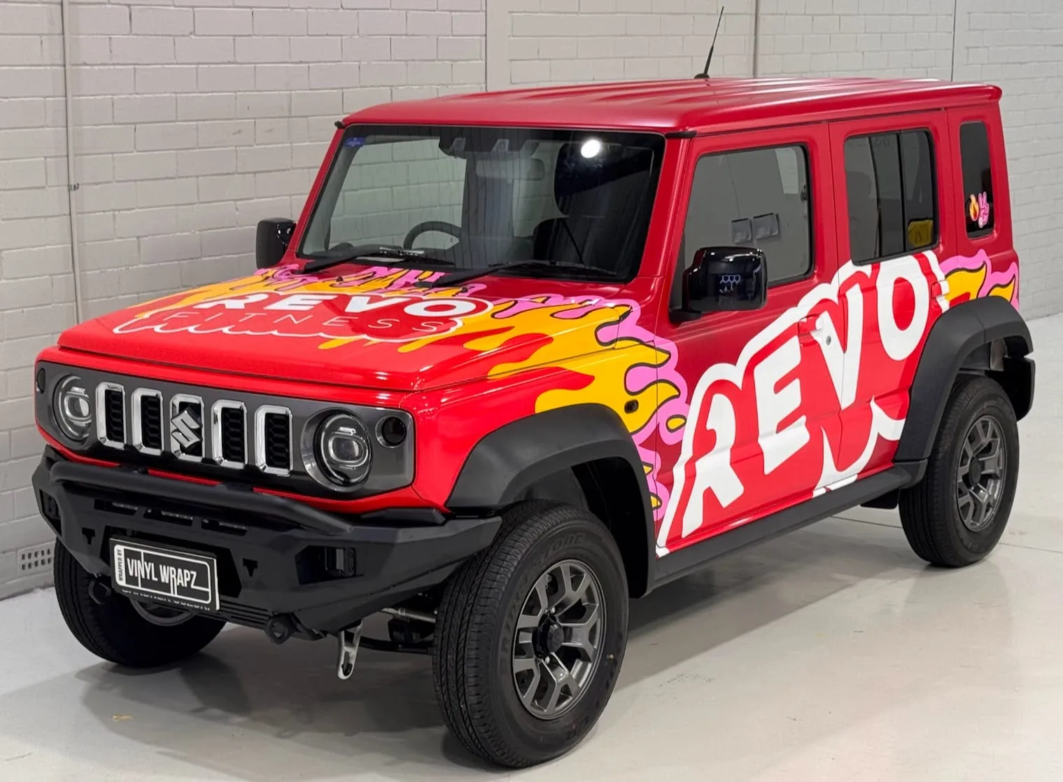 Suzuki Jimny in the printed Revo Fitness wrap, side view, by Vinyl Wrapz