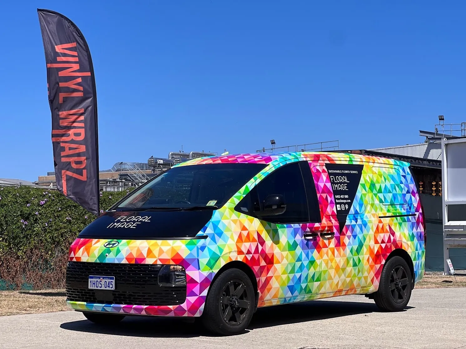 Floral Image Hyundai Staria in a full rainbow geometric printed wrap