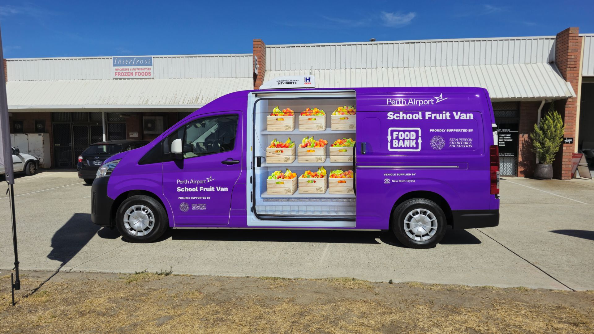 Foodbank School Fruit Van Toyota Hiace with purple vehicle branding by Vinyl Wrapz
