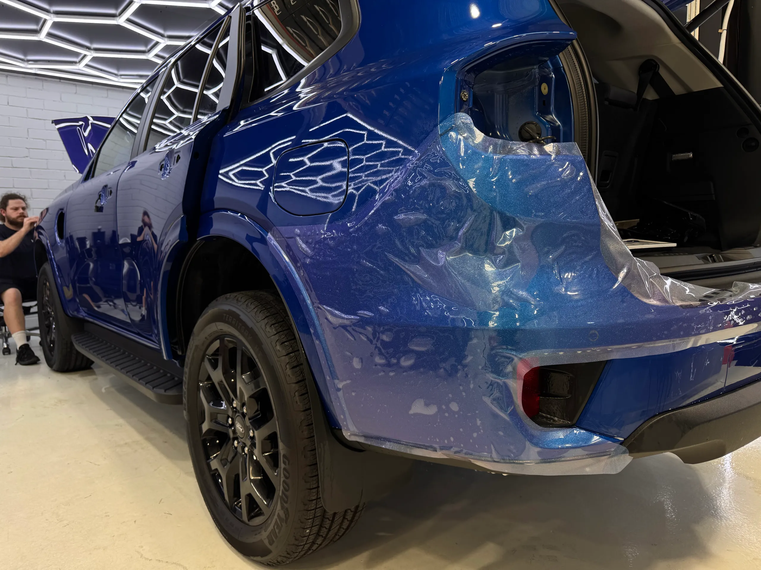 Ford Everest rear quarter during film installation with a rear light removed