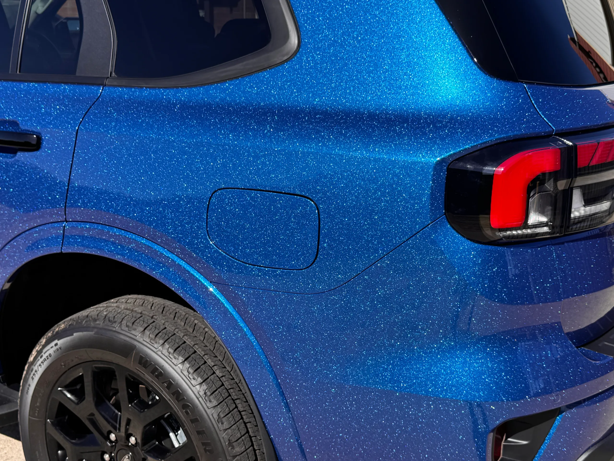 Sparkling blue finish around the Ford Everest fuel flap and rear wheel arch