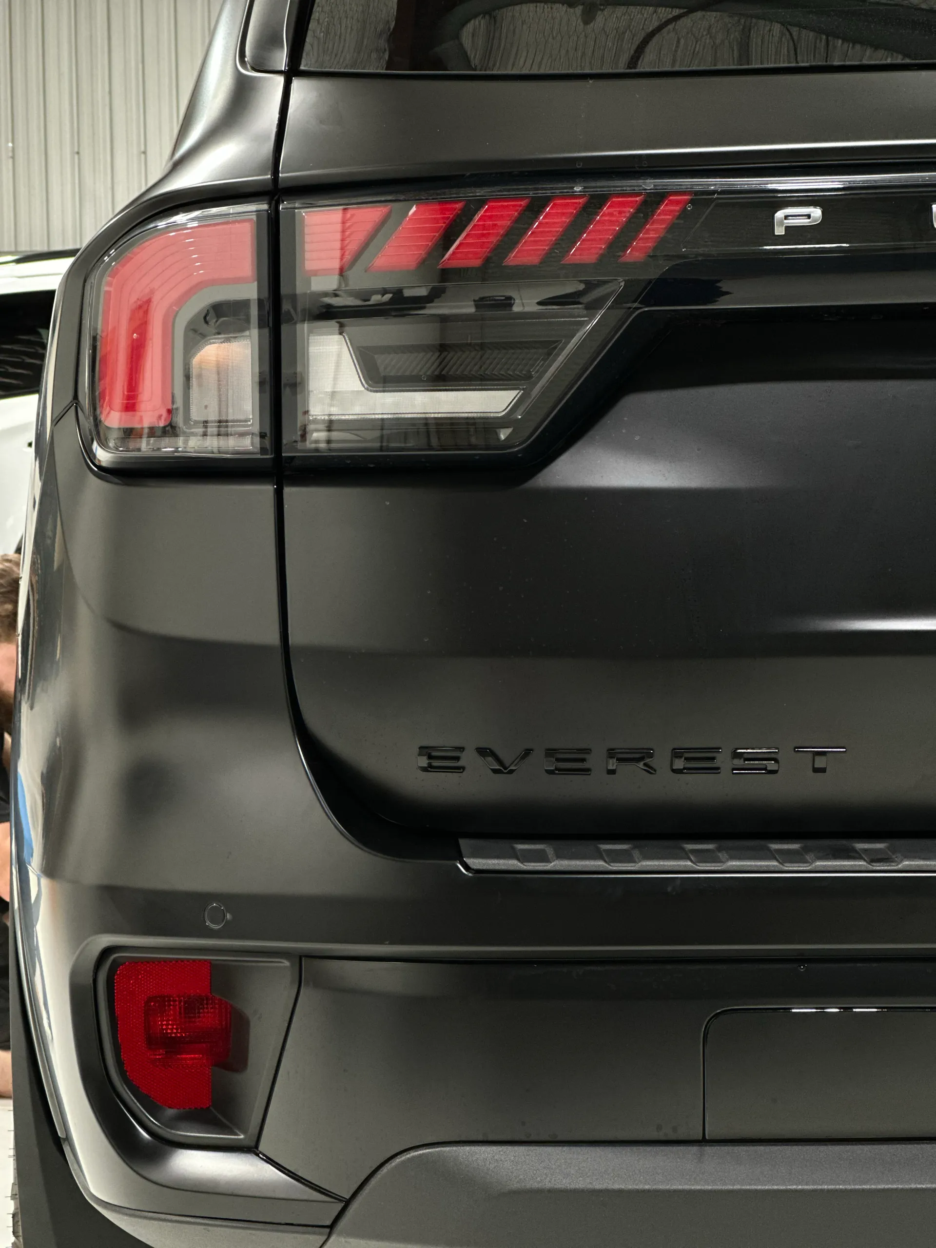 Close view of the Everest rear badge, tail light and satin black bumper