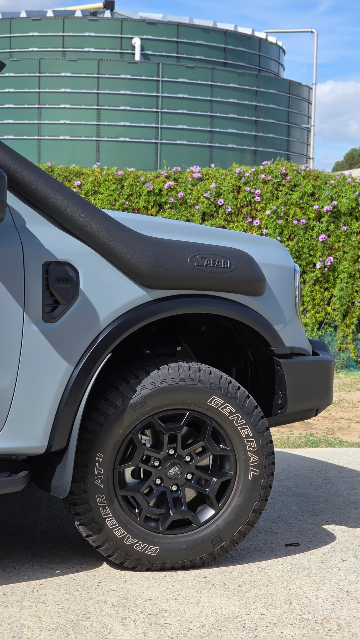 Satin grey Everest Tremor front guard, black wheel and snorkel in sunlight