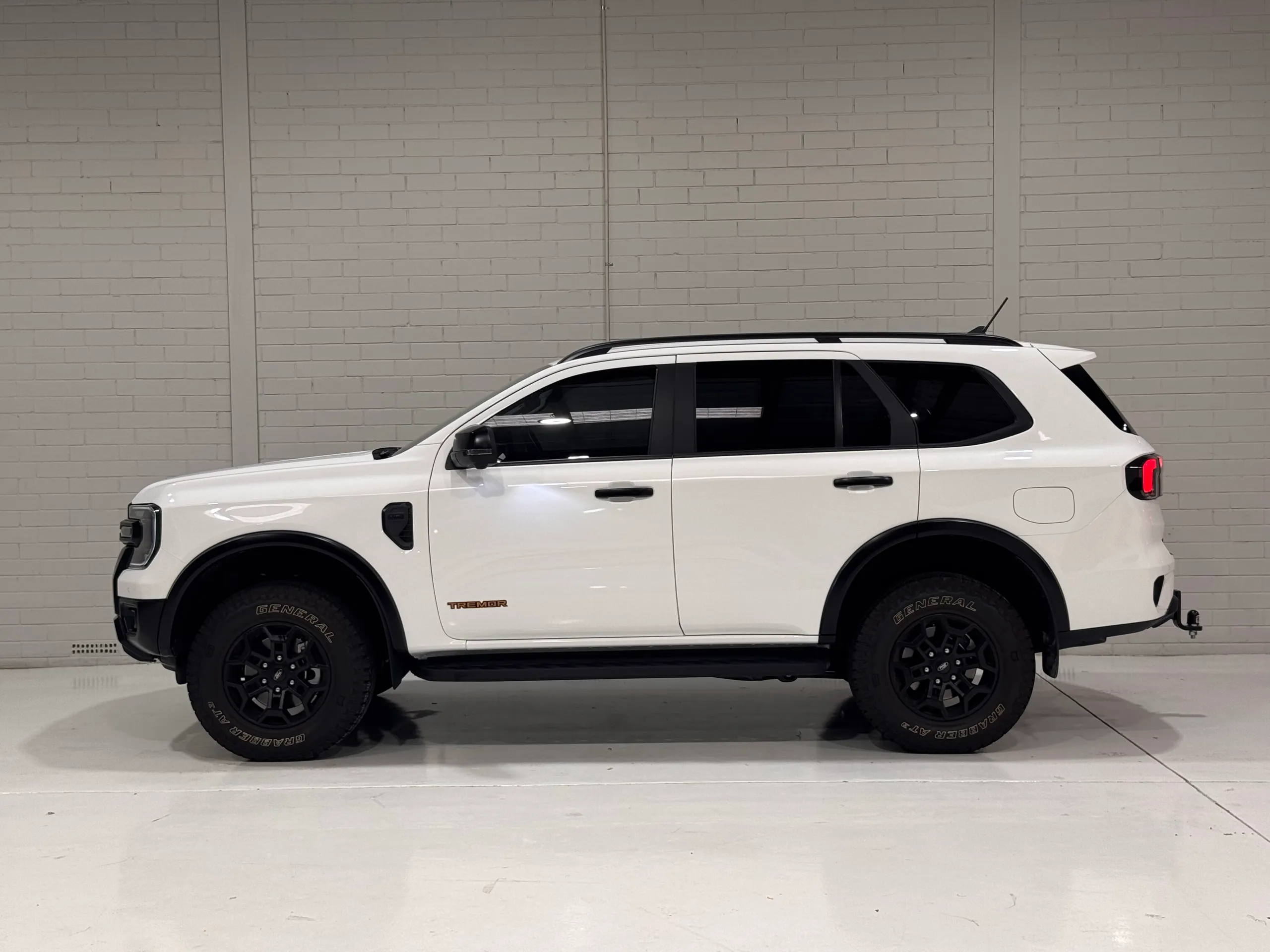 Gloss white Ford Everest Tremor in the Vinyl Wrapz studio bay
