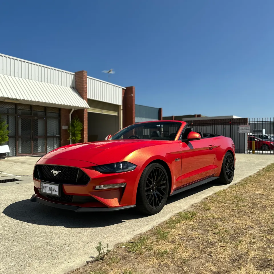 Red and gold colour-shift Ford Mustang convertible, front quarter