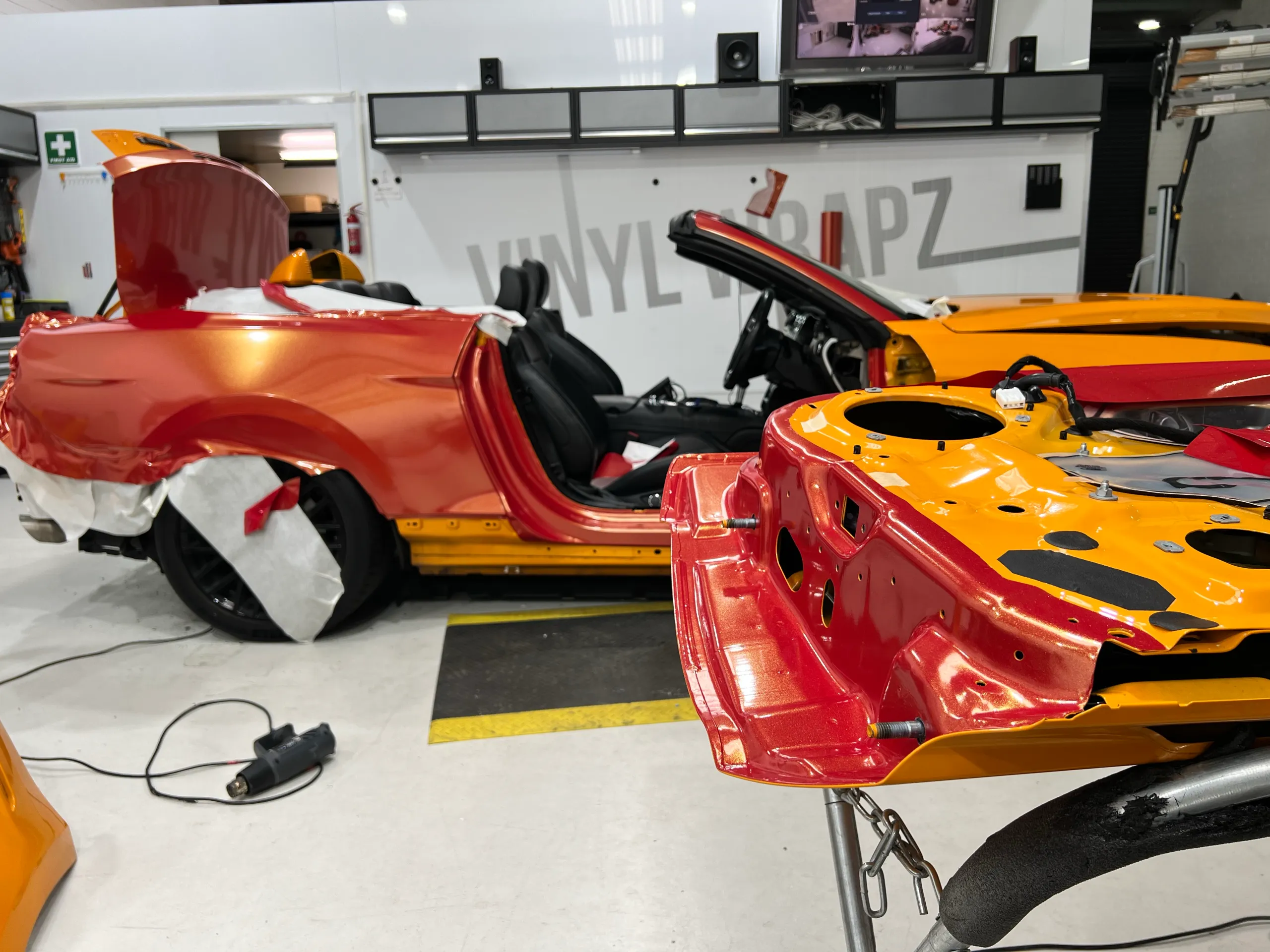 Red and gold colour-shift Ford Mustang convertible, installation detail