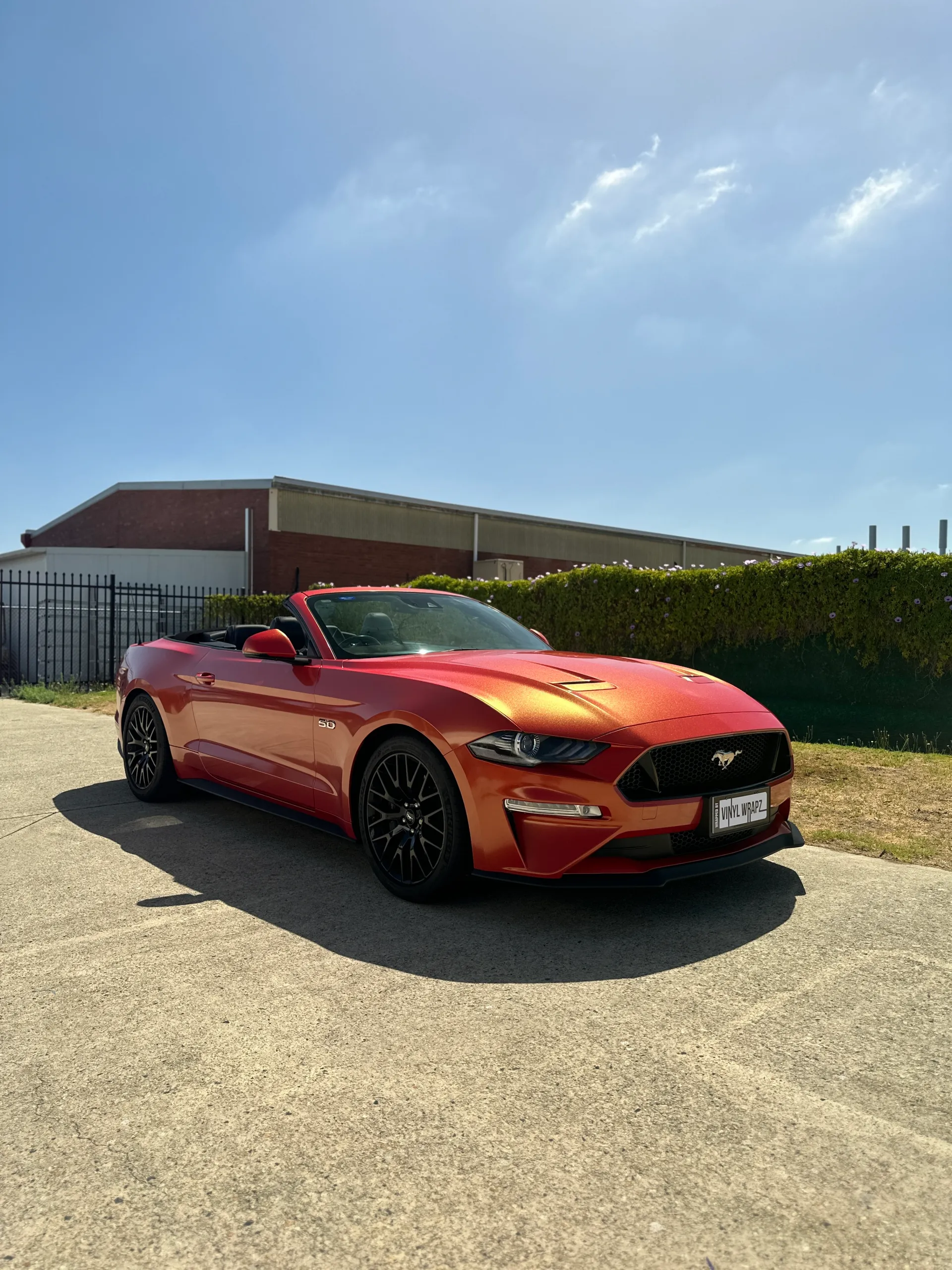 Red and gold colour-shift Ford Mustang convertible, front quarter