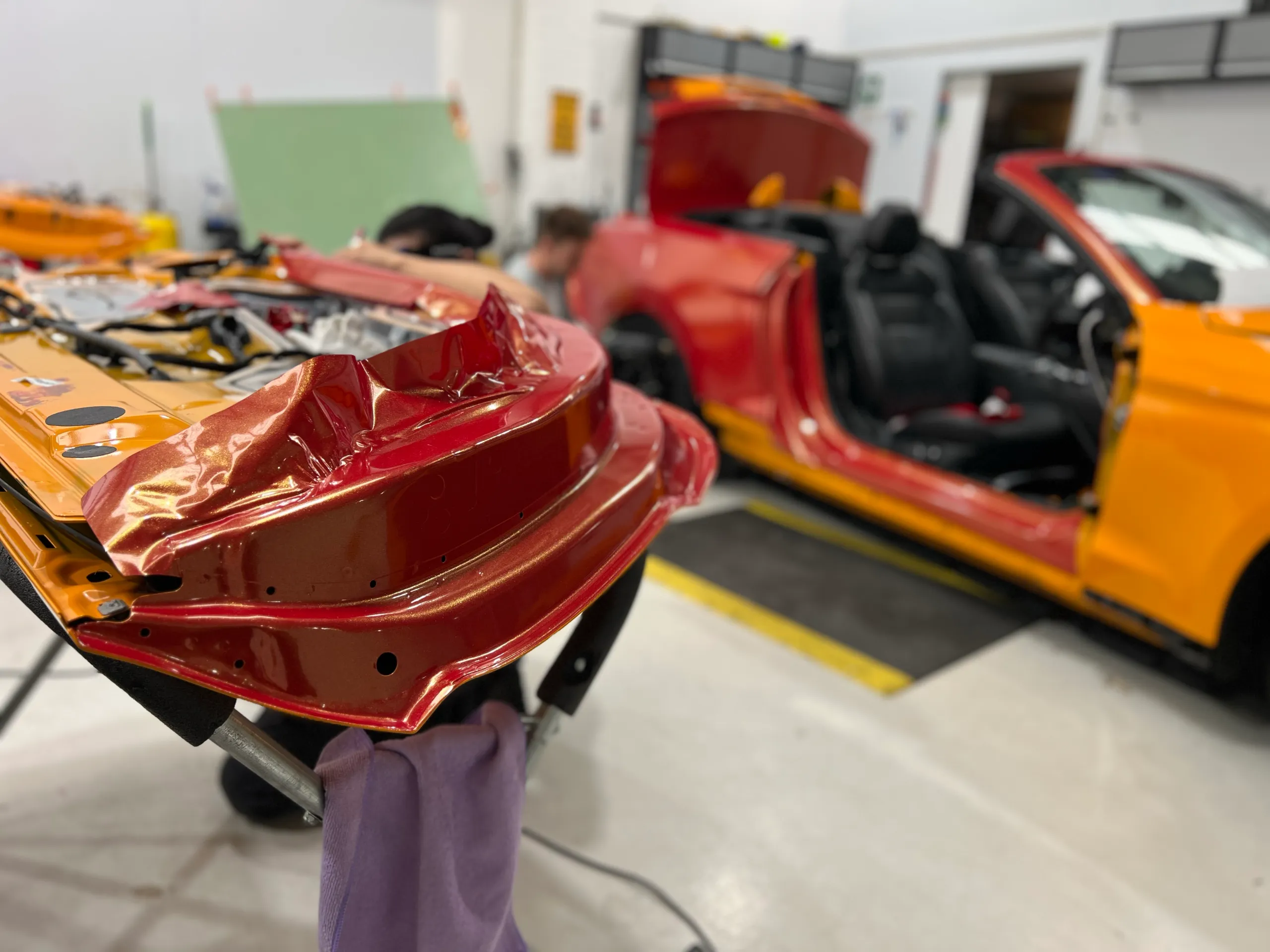 Red and gold colour-shift Ford Mustang convertible, installation detail