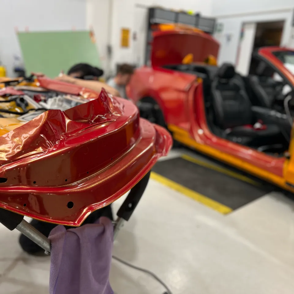 Red and gold colour-shift Ford Mustang convertible, installation detail