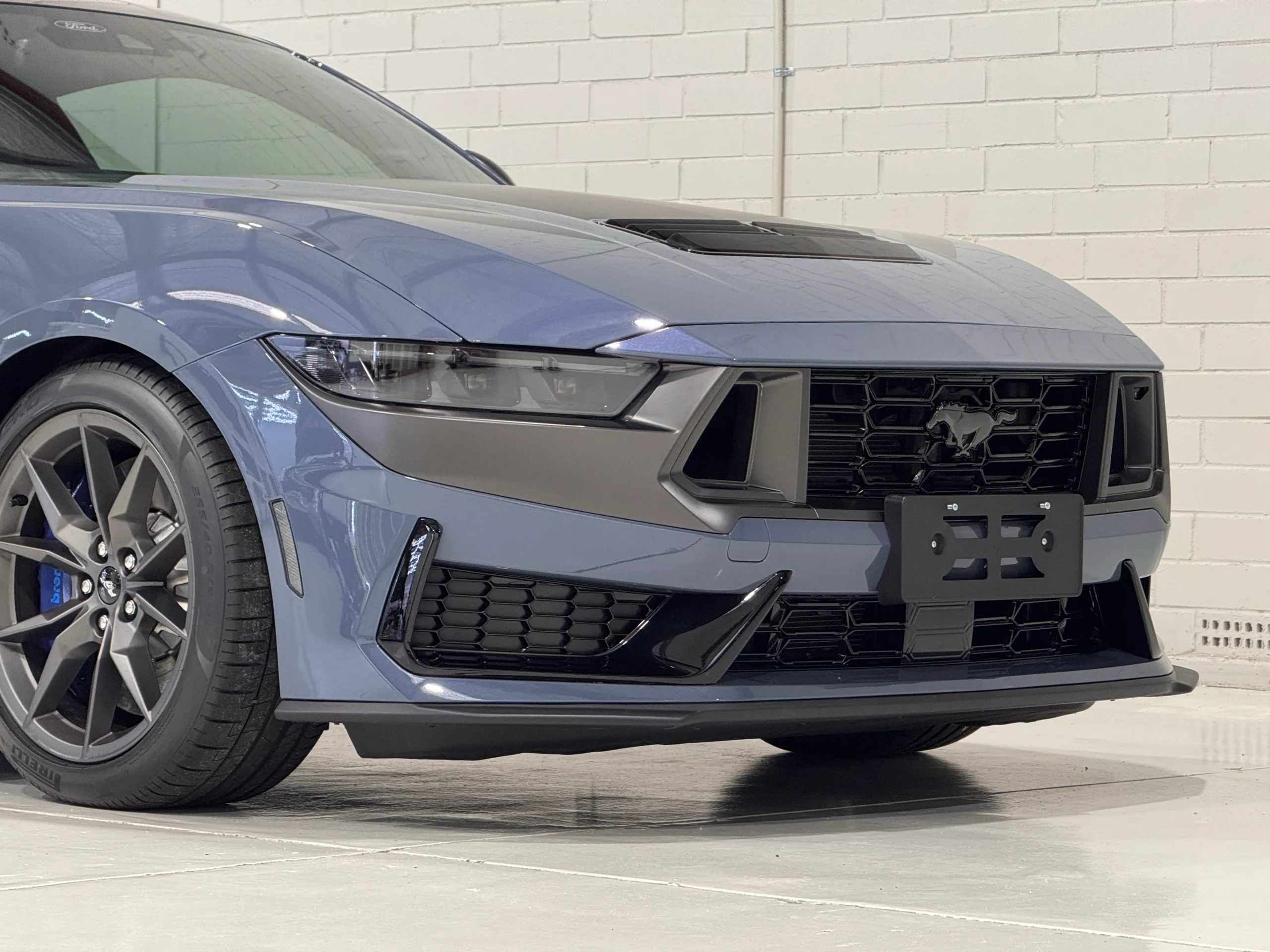 Ford Mustang Dark Horse front grille, headlight and splitter in the workshop
