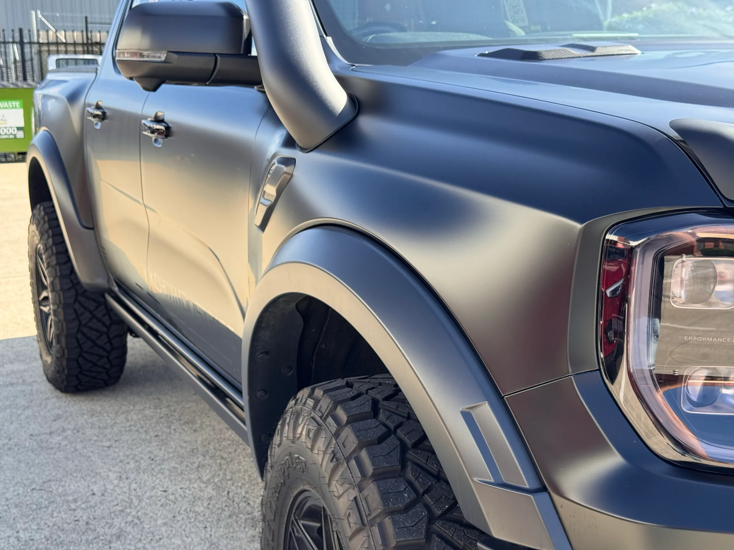 Satin grey Ranger Raptor front guard, snorkel and door in sunlight