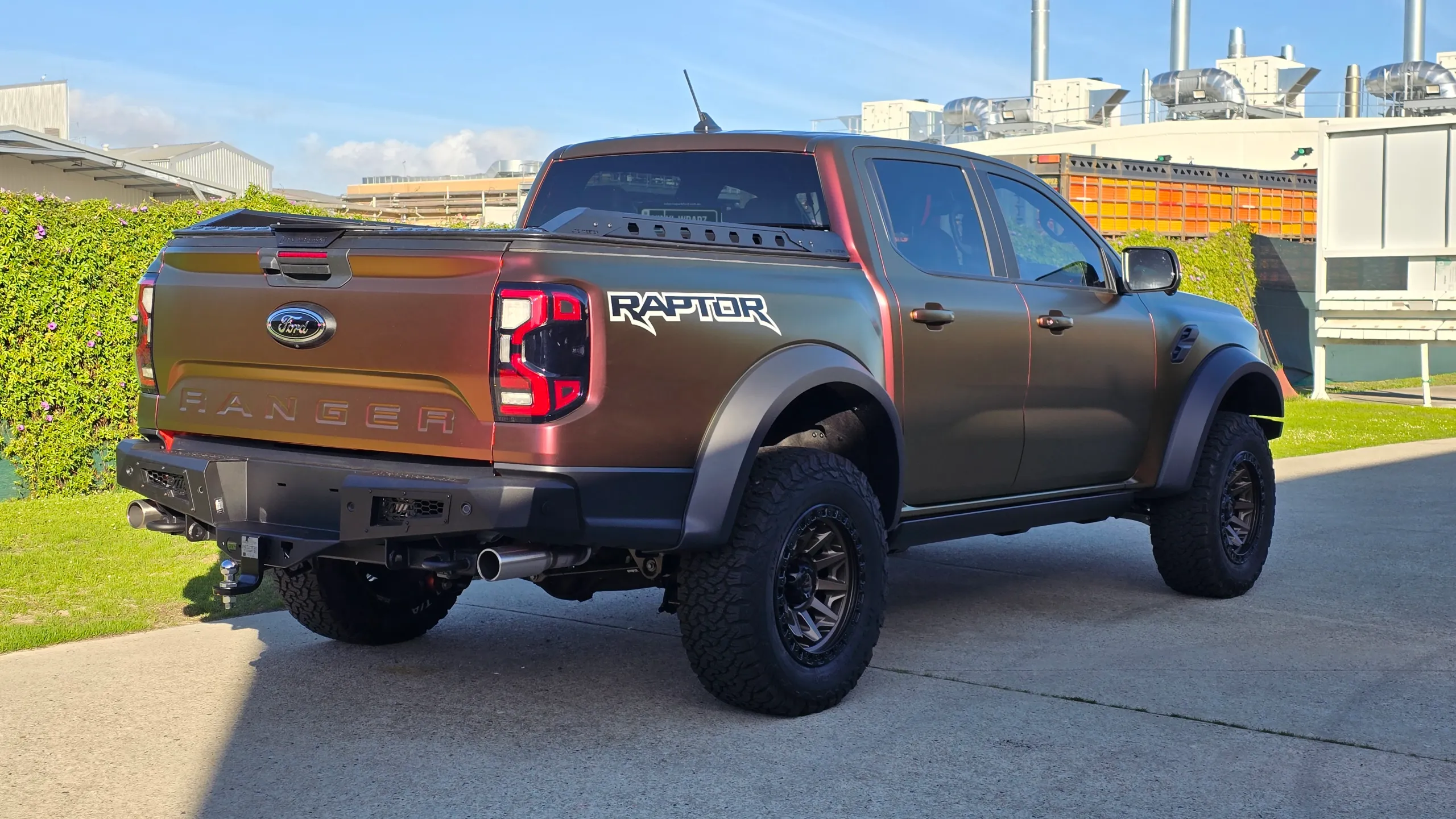 Rear-quarter view of the colour-shift Ford Ranger Raptor outdoors