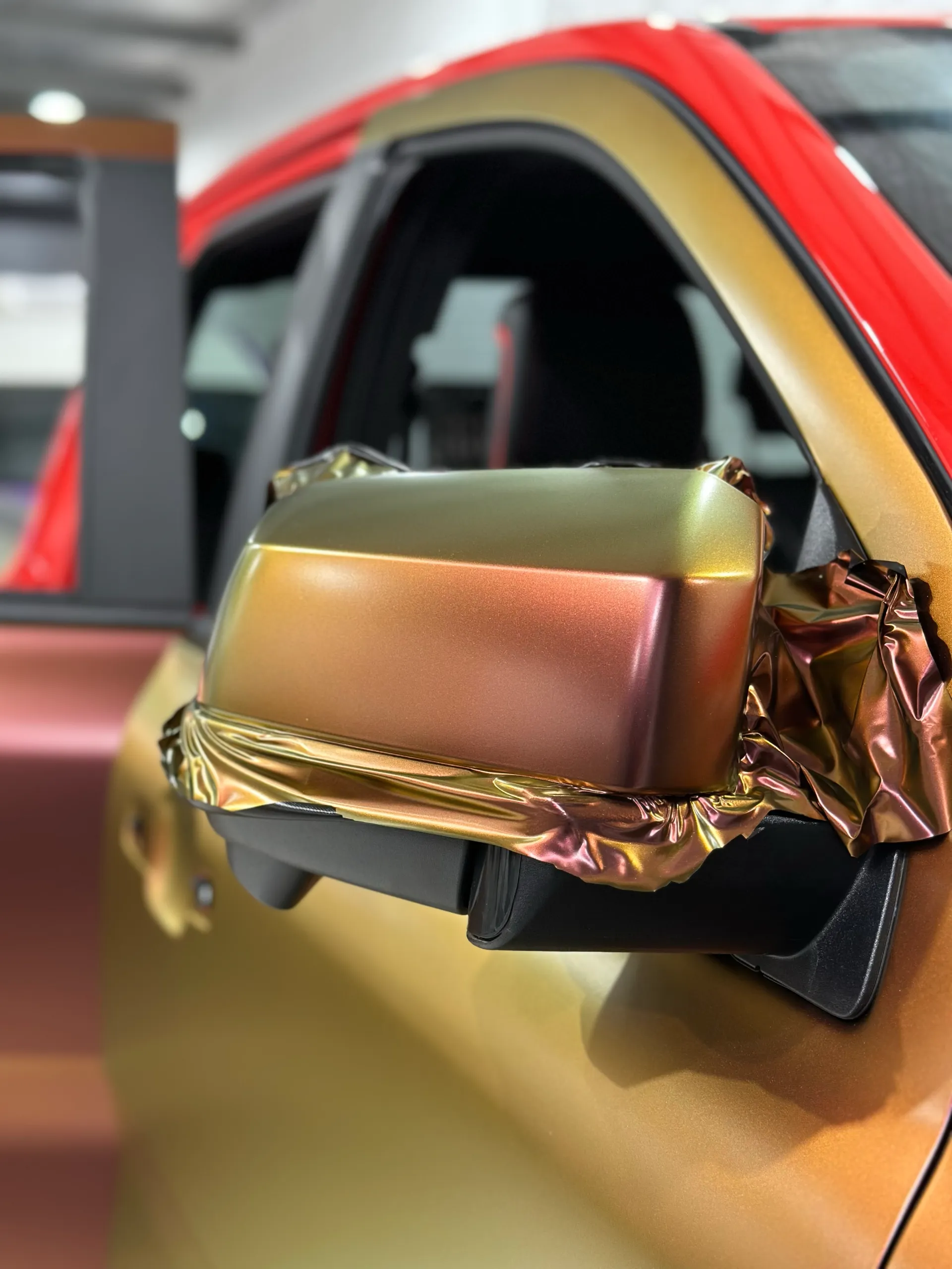 Ford Ranger Raptor mirror partly wrapped in gold and copper colour-shift film