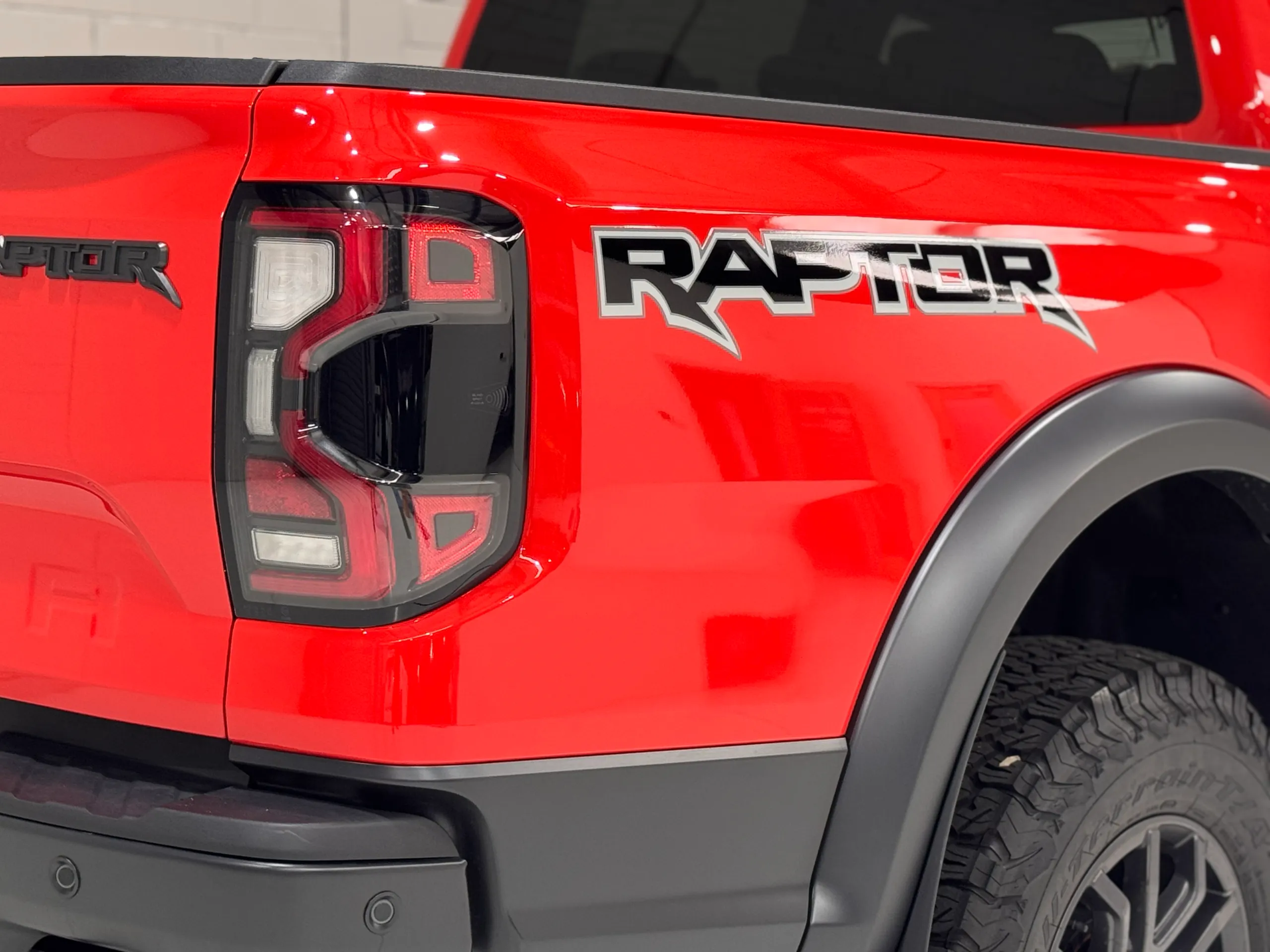 Raptor graphic and rear light against gloss red Ford Ranger bodywork