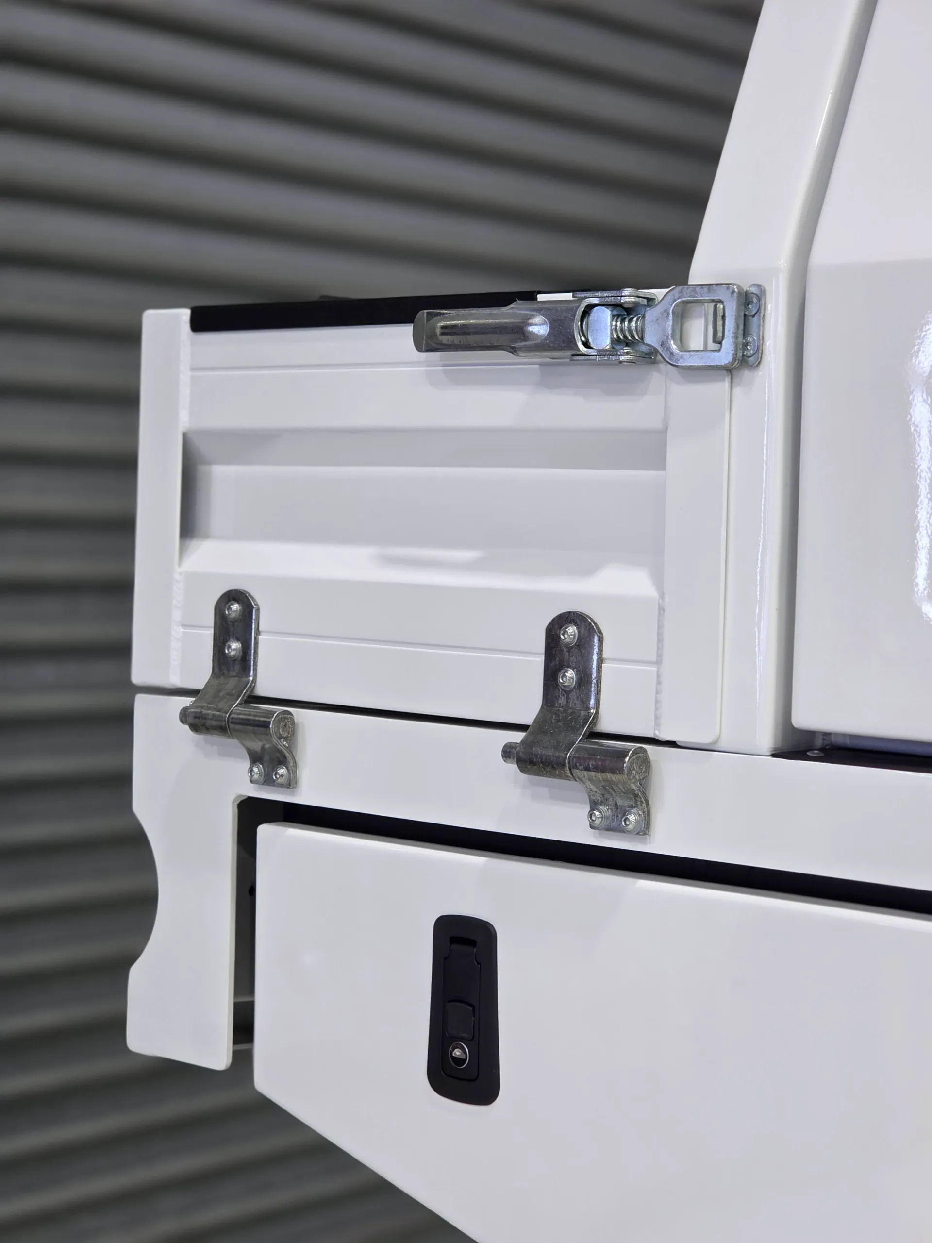 Latch and hinge details on the white Ranger tray and storage box
