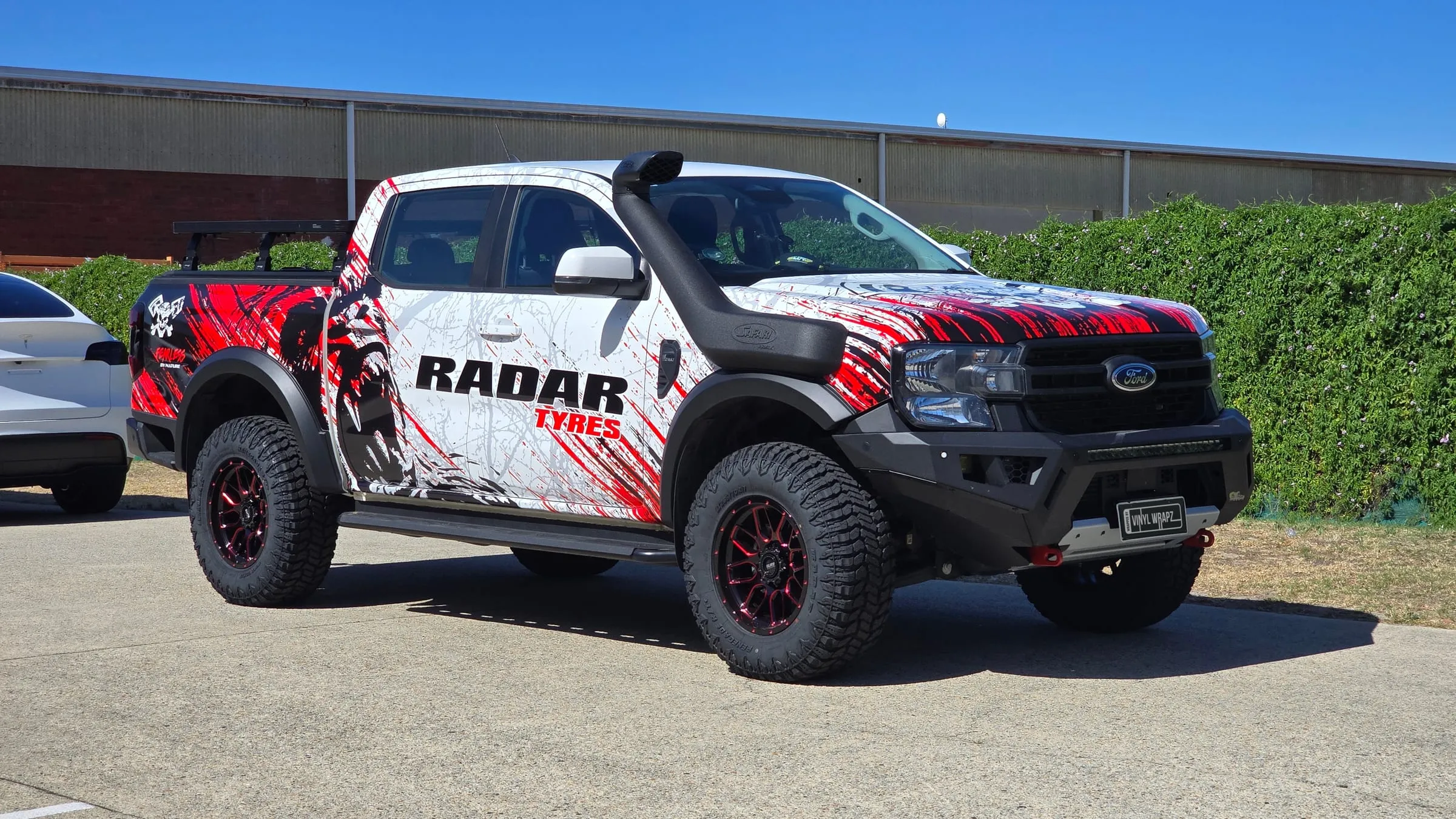 Ford Ranger XLT in a printed Radar Tyres commercial wrap, front three-quarter view, Perth